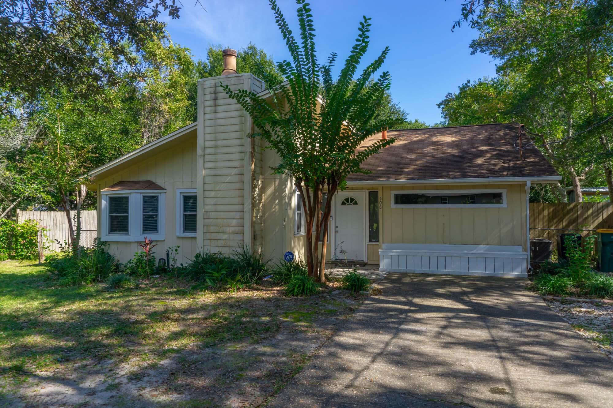 In the heart of west Destin, very close to the public boat launch and the A+rated Destin Elementary School, this charming home yields a great location!  Large backyard and side yard, perfect for storing a boat and for a growing family to play and grill out.  Open kitchen and living room floor plan with a cozy fireplace.  The hallway leading to the bedrooms creates an easy flow.  Newly renovated master bathroom claims a granite counter, new sink basin, all new hardware, new cabinets and a new shower/bath combination with attractive tile backsplash.  This property is being sold ''AS IS.''  The home is in need of repair and needs a new roof..