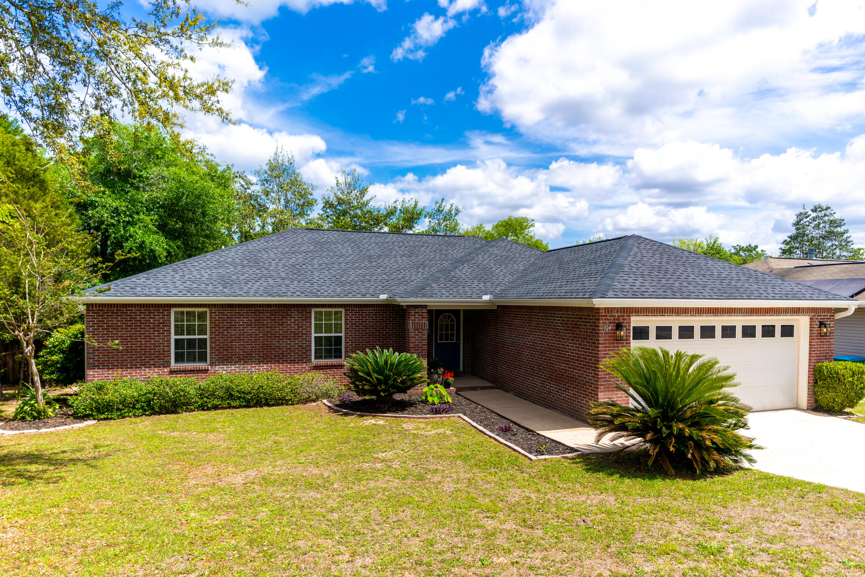 This stunning 4/2 home has been tastefully remodeled and is located on the southeast side of Crestview! New roof (12.2021) and updated landscaping. When you walk in the front door, you will find an open floor plan home with updated flooring, lighting, paint, blinds, & electrical outlets! The kitchen is complete with freshly painted wood cabinets, new tile, backsplash, and an open view to the dining and living. The en suite primary bathroom has new tile, new paint, a huge soaking tub, walk-in closet, and separate water closet. The separate shower is very relaxing thanks to new tile, pebble stone floor, and a rain shower head! The back yard has two large decks and a great sized yard with a perfect view of all the trees and birds. Fridge does not convey with property.