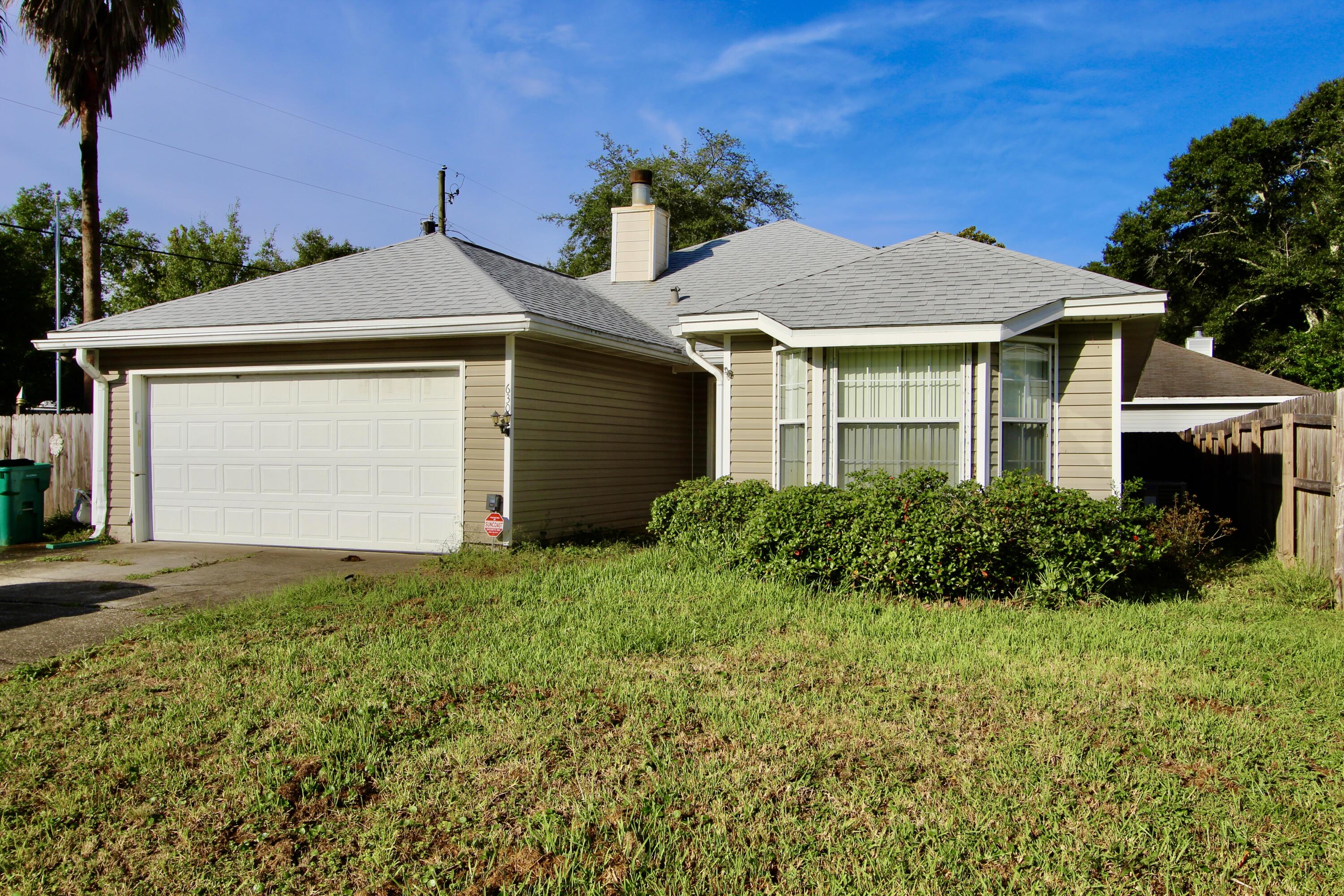 This 3 bed 2 bath home is conveniently located close to shops, schools, beaches, and bases. When you enter the home you will notice the large living room with a cathedral ceiling, gas log fireplace, and built in shelving. Split floor plan, the guest rooms are off the living room and the master is off the kitchen area. As you cross the living room you will find the kitchen and dining room area that has an exit to the covered patio and fenced in yard.  Roof was replaced in 2017 and there is a 15 kW 60 Hz GUARDIAN PLUS AIR-COOLED HOME GENERATOR by Generac