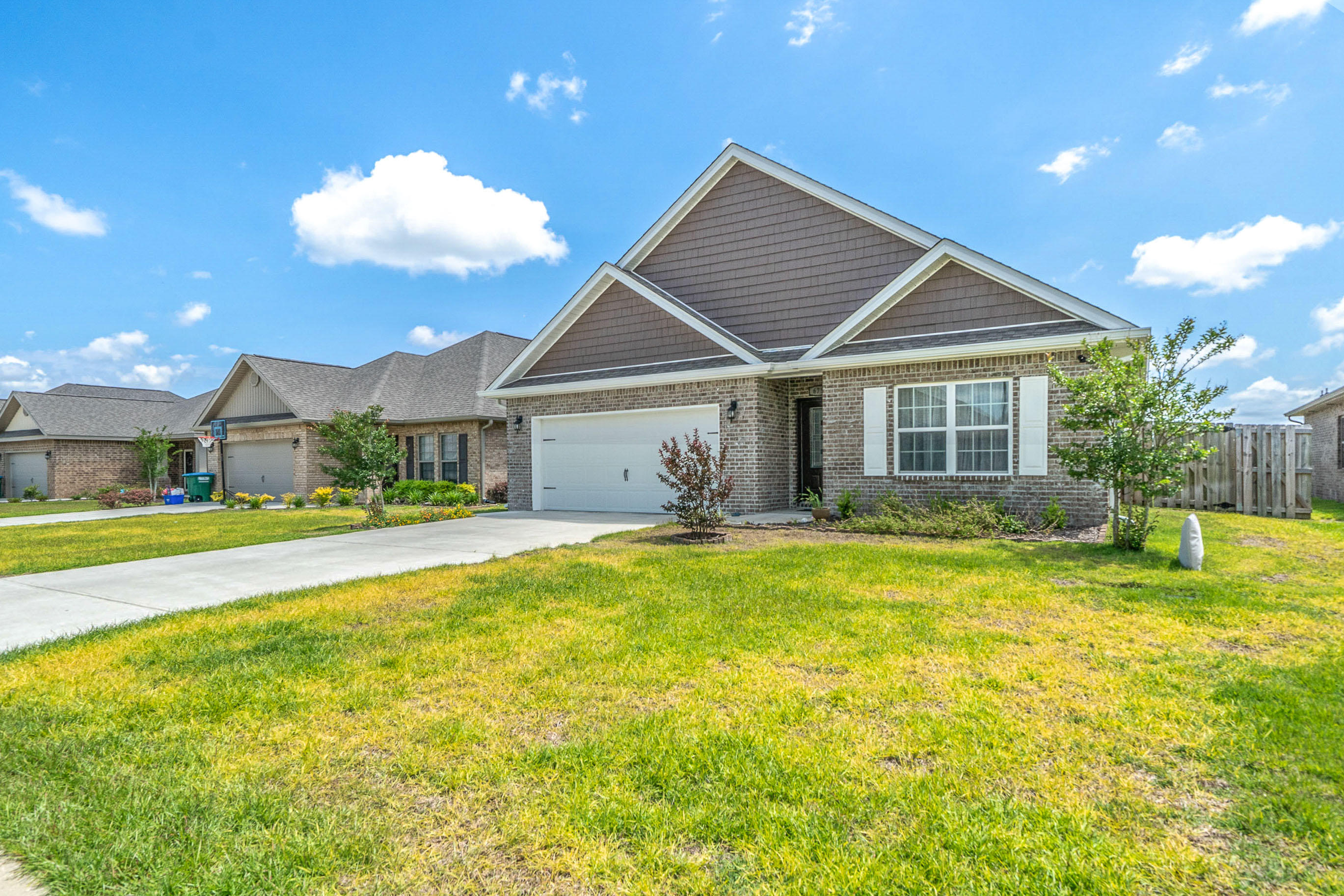 This 4 bedroom 2 bathroom home is ideally located to dining, shopping, hospitals,, and is an easy commute to the numerous military bases in the area. Additionally both the elementary school and middle school are adjacent to the community. The split bedroom floor plan is perfect, featuring an open kitchen with large island, walk in pantry, stainless steel finished appliances and granite counters. The Great Room features a double trey ceiling and open views of the landscaped back yard. The Master bedroom has a trey ceiling and master bathroom has a double vanity sink, soaking tub, and fully tiled shower with clear glass door. This home has many additions not found on any other Rhett model in the community. They include, screened porch, additional LED lights,, etc. Check documents for more