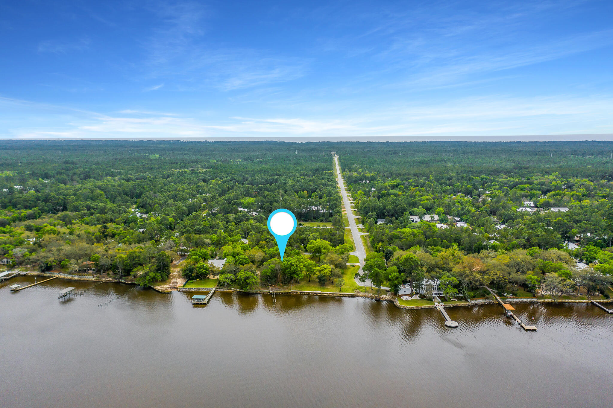 This beautiful bay front lot has it all; forever views, mature magnolias and live oaks and plenty of room to build your waterfront dream home. 300 feet of depth provides a large buildable footprint. Spend your mornings kayaking or paddle boarding on the bay and your afternoons cruising the bay on the boat. This lot is less than 4 miles from the white sandy beaches of the Gulf Coast. It is close enough to Grayton Beach, Seaside and WaterColor to take advantage of the restaurants and action, but tucked away for privacy in Point Washington. Several new homes have been built or are under construction on this street making it the preferred street in Point Washington.