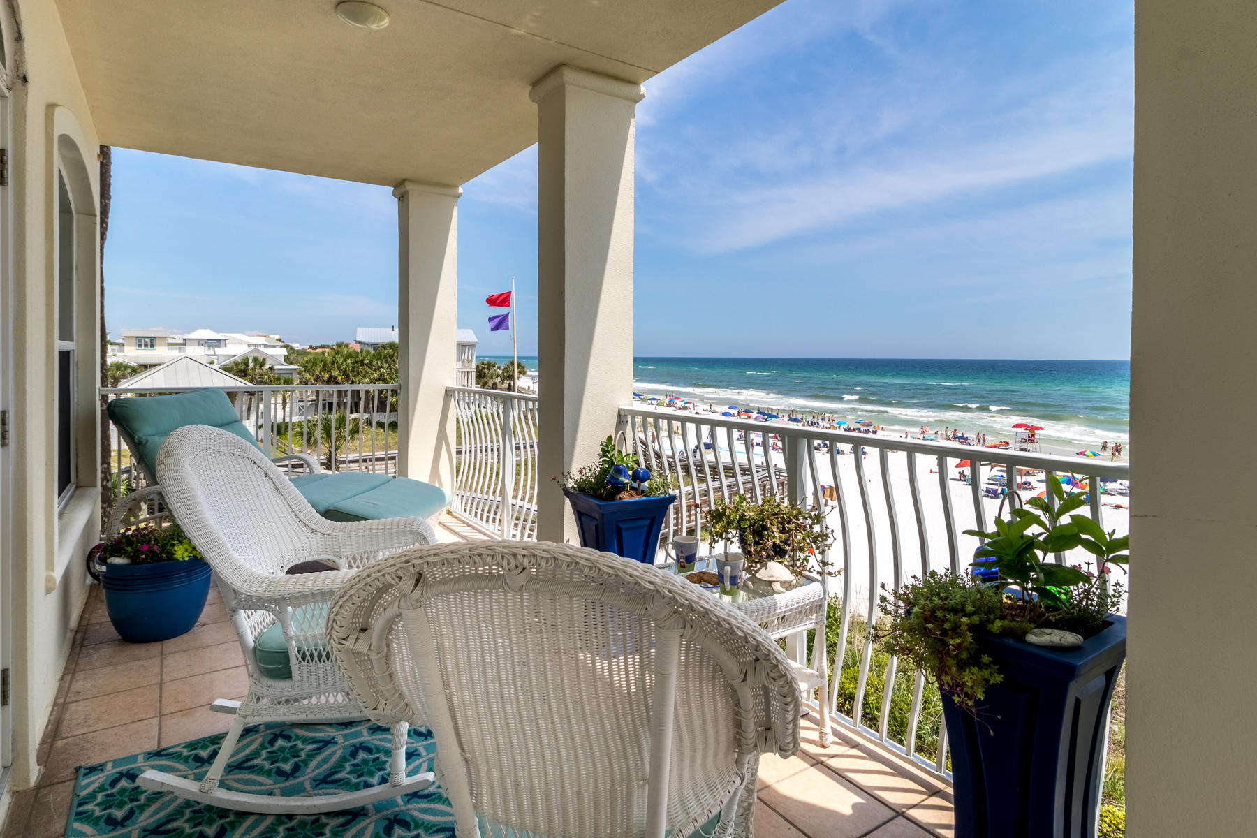 VILLA ST JACQUES....rare second floor unit at The Villas!  As you enter this gulf front condominium, you realize that you have arrived at a special place.  The custom renovation and features set this home apart.  Attention to every detail is exhibited throughout the residence.  Originally designed as a full-time residence, the owner of this unit spared no expense in making this home a one-of-a-kind home on the beach.   Custom woodwork, custom cabinets, signature lighting, designer kitchen, and imported flooring are a few of the features of this home.  Hurricane rated windows were installed two years ago completing the renovation.  If you seek a permanent home at the beach, are looking for that second home for family getaways, or want an investment property, this home is for you! As you walk in the foyer, note the first of many Chihuly type light fixtures showing off the upscale mudroom/foyer.  The shabby chick bench is a repurposed antique headboard accented by an antique, repurposed door  hanging horizontal on the wall acting as a mirror and a place to hang your towels and hats.

Directly off the foyer is the first of four bedrooms with an ensuite displaying jellyfish lights.  The headboard is a repurposed antique door.

Down the hall, note the hand blown Murano glass ceiling lights accenting the  photos from Key West.  The floors are  porcelain tiles from Spain.

To your left off the hallway is the second of four bedrooms  with shabby chic furniture.

To your right off the hallway is the third of four bedrooms with bunk beds from Restoration Hardware.  Note the large, custom made mirror over the dresser.

Across from the bunk bed room is the second of three bathrooms.  The floating coke glass cabinet has a concrete infinity sink.

Further on the left down the hall is the last of the four bedrooms with a king size bed and ensuite.  The custom  made cabinets have  crystal quartz translucent counters  with double sinks highlighted by a crystal chandelier.  Note the custom window treatments highlighting the beachfront view.

Outside the master bedroom is a gourmet kitchen with concrete counters, Thermidor appliances, and custom cabinets.  The kitchen is fully equipped with glasses, pots, utensils, and a set for 24 of dishes from Italy.  The four barstools swivel and are height adjusted to act as extra dining room chairs.  There are Chihuly type pendants over the counter.  The panoramic view just begins.

The shabby chic dining room table and eight chairs are highlighted by another Chihuly type chandelier.  The window box and shelving unit provide for additional storage.

The living room has a sectional sofa made by Four Seasons and has two different washable slipcovers.  The custom made window treatments with matching pillows are linen. The limestone fireplace holds the tv which can be hidden by a scraped white oak shutter.  Note the window treatment for the french doors are made of the same material.  The tribble crown molding continues to add a touch of New Orleans.

The balcony directly overlooking the gulf has amble furniture for relaxing. 

The Villa is completed furnished for immediate occupancy and rental.  Extra sheets and coverlets are provided for each bedroom. Villa St Jacques is the only unit that has had all of the windows upgraded to current code.
