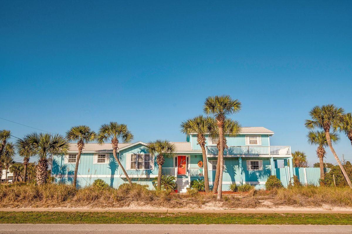 Check out this remodeled home on Okaloosa Island... it literally sits across the street from the Gulf of Mexico and a beach access. Hang out and enjoy Gulf views on the large wrap-around balcony... or sit back and look out over your spacious, fenced back yard huge private swimming pool. Inside you will find an open floor plan with a recently updated kitchen that overlooks the living area. This house is on a corner lot which gives you just over a one-quarter of an acre... perfect for a boat or camper.