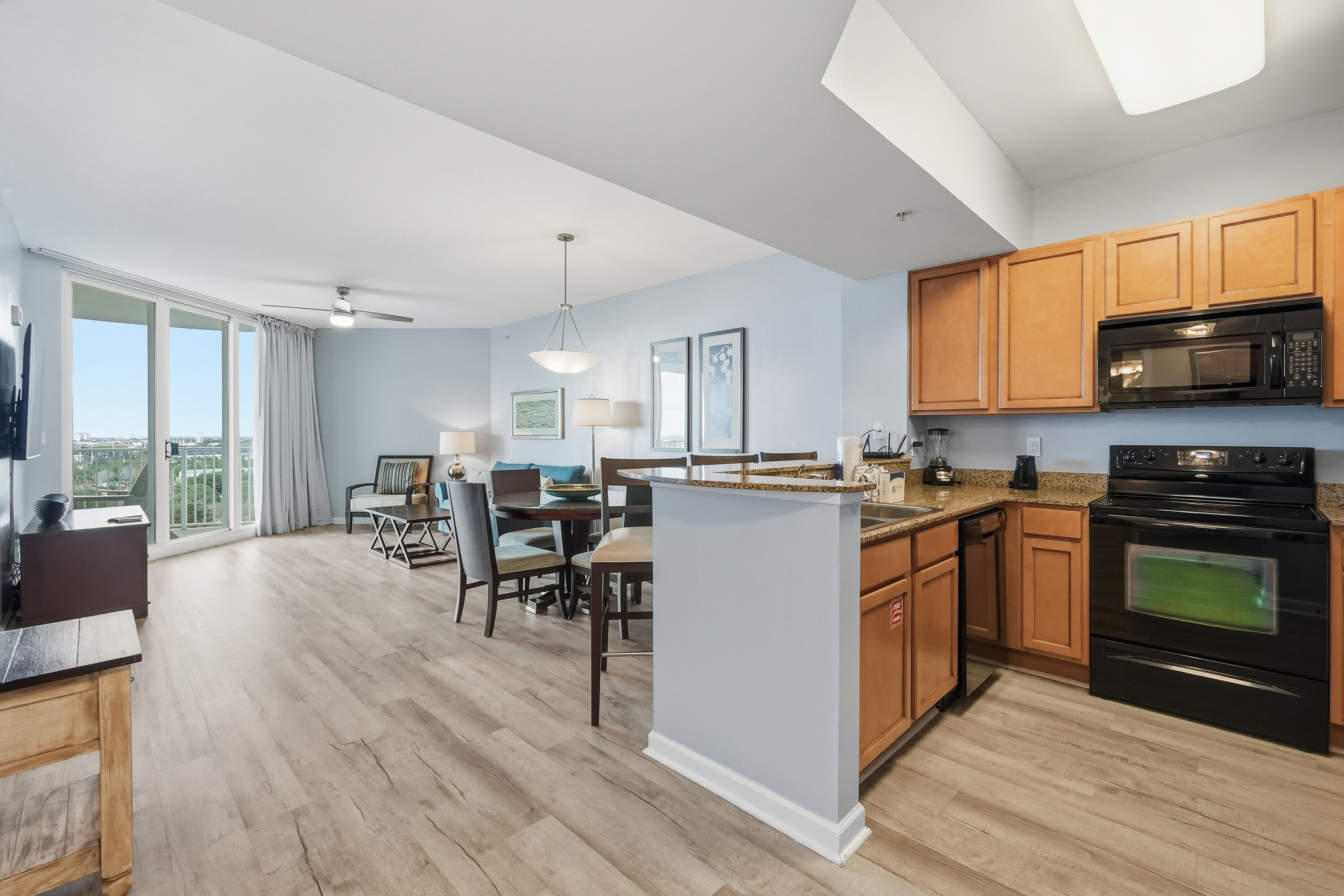 Perched on the 11th floor and facing west, this beautifully appointed junior two-bedroom, two-bath residence at The Palms of Destin delivers breathtaking panoramic views of the Destin skyline and the Gulf of Mexico. From your private balcony, take in vibrant sunsets and enjoy front-row seats to seasonal fireworks lighting up the Destin Harbor an unforgettable backdrop for coastal living.

Inside, the bright, open concept layout seamlessly connects the living and dining spaces to the expansive balcony, creating the perfect setting for entertaining or unwinding after a day at the beach. The updated kitchen features granite countertops, light cabinetry, and a clean, modern feel. Recently upgraded flooring runs throughout the unit, no carpet anywhere, making this home both stylish and low maintenance. Offered fully furnished, this turnkey condo is ready for immediate enjoyment or rental income potential.

Residents and guests are treated to an impressive array of resort-style amenities. The Palms boasts Destin's largest lagoon-style pool, complete with cascading waterfalls, along with a heated pool, hot tub, children's splash pad, and kiddie pool. Additional on-site features include a fitness center, tennis, pickleball, and basketball courts, playground, grilling area, EV charging stations, and a seasonal restaurant and coffee shop.

HOA fees provide exceptional value, covering all utilities, including electricity, water, trash, cable, and WiFi. Covered parking is included, and a complimentary seasonal shuttle offers quick access to the sugar white sands at June White Decker Beach.

Ideally located in the heart of the "World's Luckiest Fishing Village," you're just minutes from the Destin Harbor Boardwalk, championship golf courses, shopping at Destin Commons, dining, fishing, water parks, and the airport.

Whether you're searching for a vacation getaway, investment property, or your own slice of paradise on the Emerald Coast, this Palms of Destin residence checks every box. Schedule your private showing today. Buyer to verify all information.