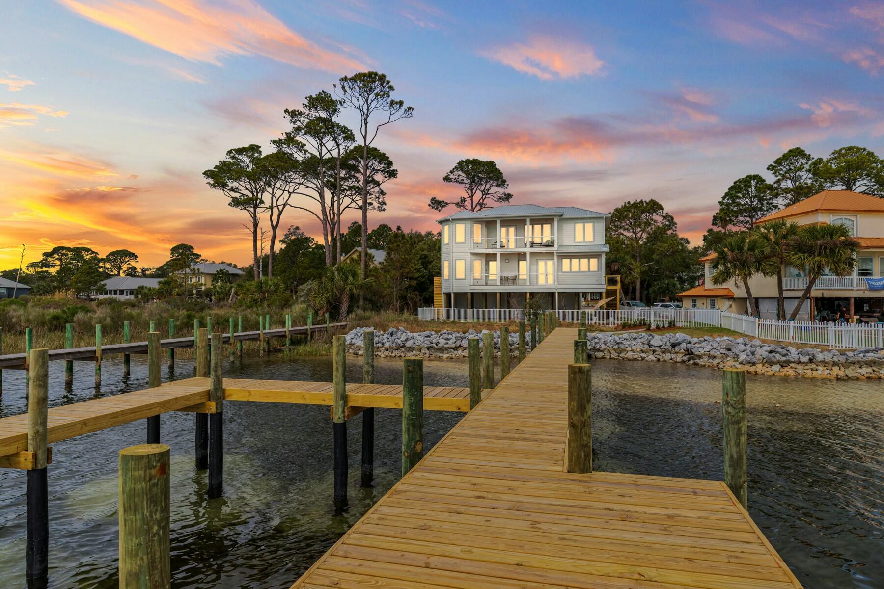 NEW lower price on this custom built waterfront home in the heart of Fort Walton Beach with deepwater access and a brand new dock!

Nestled just off Brooks Street with sweeping views of Choctawhatchee Bay, this custom-built 5-bedroom pool home is an entertainer's dream. Featuring a state-of-the-art chef's kitchen, hidden butler's pantry, and a fully equipped outdoor kitchen on the pool level, it's designed for seamless indoor-outdoor living.

Bring your boat—this home includes a brand new dock and private boat slip, offering direct access to Crab Island, Santa Rosa Sound, the East Pass, and the Gulf of Mexico.

Every inch of this home showcases high-end finishes, from custom tilework in all four full bathrooms to thoughtful upgrades like a wet bar in the main living area, a third-floor flex space with built-in cabinetry and a beverage fridge and two balconies capturing panoramic waterfront views that are impossible to beat!

Enjoy true convenience with two laundry rooms and an elevator providing step-free access to all levels. Relax poolside on the custom paver patio or unwind on the sun shelf in the heated pool, making it perfect to enjoy year round. The raised platform outside the primary suite ensures easy access to AC units, pool equipment, and the whole-home generator.

This never-lived-in, one-of-a-kind waterfront home is a rare opportunity in downtown Fort Walton Beach. Schedule your private showing today and experience luxury coastal living at its finest!