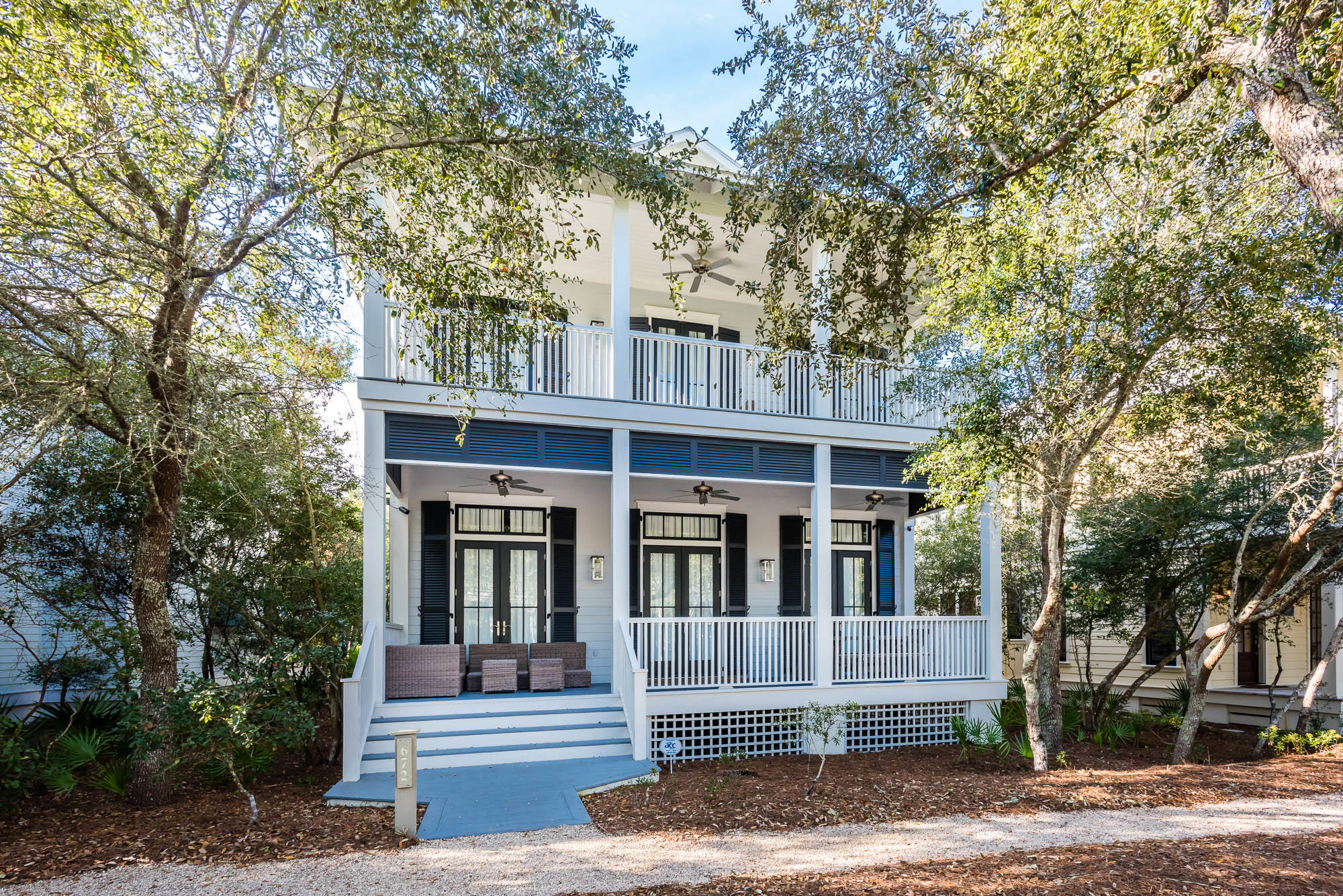 Located in the heart of phase I, this WaterColor beach house welcomes you home with its expansive front porch meant for enjoying the Florida outdoors. The double door entry receives guests to the homes expansive, open concept great room featuring beautiful hardwood floors and wainscoting throughout. Natural light floods the large living area that is equipped with crisp white, upscale coastal dcor and a painted brick fireplace to warm up Florida's coolest evenings. The home's large dining area offers a solid wood table with seating for eight and opens up to the expansive kitchen featuring a big breakfast bar with marble countertops and additional seating for six, contemporary pendant lights, Thermador dishwasher and fridge, no slam cabinets and drawers, an apron sink, and a large center is island with Thermador stove top and vented hood. The homes great room also features a large wet bar presenting marble countertops, tile backsplash, Sub-zero beverage drawers and a wine fridge, which makes this space perfect for entertaining. The modern pendant lights transport you down the hallway to a large bunk room with a detached full bath. The soaring shiplap walls carry you up to the second floor where you will find another expansive bunk room with an attached full bath, a master bedroom featuring a seating area, his and her closets, wainscoting, and an attached master bath with a large garden tub and contemporary chandelier, dual vanities with tub sinks, tile shower with a rainfall shower head, and a pocket door. On this level, you will also find the laundry room and what could be a second master bedroom, currently being utilized as a double room with two twin beds, an attached bath with dual vanities and a large closet. Both of these front bedrooms have access to a shared covered porch. Louvered shutters don the homes exterior and outdoor fans help cool the hottest Florida day. Enjoy the homes screened in back porch with vaulted ceilings, covered and uncovered parking spots for up to 4 cars with an outdoor shower and convenient bike parking. This home's appointed carriage house offers an outdoor storage closet, queen bed, mini fridge, microwave, a dining area featuring a corner bench with a contemporary chandelier and full bathroom. This coastal retreat is a must see! Call The Beach Group today to schedule a showing!