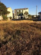 Ready to build your beach cottage? This fantastic lot is located on the west end of Panama City Beach. It has sewer and water permitted and paid for. TRULY READY TO BUILD! The sewer line was bored underground from across the street and stubbed out on the lot. Enjoy this quiet secluded area of PCB but yet so close and conveniently located to Pier Parks 100's of shops, dining and entertainment. You don't have to worry about high season traffic jams on the west end! The Gulf of Mexico is legitimately one of the most beautiful beaches in the world and from this lot you are less than two blocks away. At times you can hear the surf and you can always just go out your front door and walk there! Laguna Beach on the west end of Panama City Beach is by far the most desirable area to build your fulltime home or to vacation. There are no new buyer fees , no architectural review boards, and no HOA fees. Live at the beach...live in paradise!!!