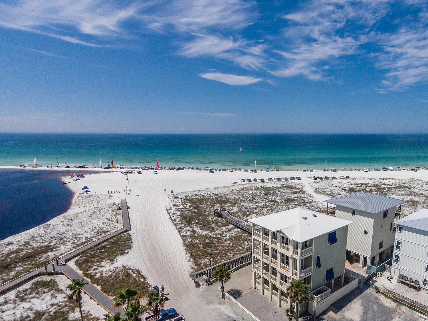 PRICE REDUCED ANOTHER $140,000!!! SELLER SAYS 'BRING OFFER!!!'- Well appointed 'Hawk's Nest' provides unparalleled, spectacular panoramic views of the Gulf of Mexico, Western Lake and Grayton's vast state-preserved dunes and beaches. Located in the heart of Old Grayton Beach, this multi-level,traditional beach house features 2,996 sq', 5 bedrooms, 4.5 baths, a very grand Great Room (kitchen, living, dining) with huge windows, 10' ceilings, granite countertops and hardwood oak floors. ALL NEW APPLIANCES, FLOORING, BEDDING & FURNISHINGS IN MARCH 2015!!! Master Bedroom and 2 of 4 other bedrooms open onto the wrap around decks on each of the top 3 floors. See the Gulf, lake, State beaches, and even Seaside from these balconies!BEST BEACH FRONT DEAL!!! Step outside onto the beach,launch a SUP board or kayak in the  lake or Gulf-both in your front yard!! Shop just up the street at The Zoo Gallery, and only steps to Shorty's or The Red Bar. There is Public boat access/launch to Western Lake within 2 blocks. Sold fully furnished-a few personal items will not convey-and rental ready. Good elevations, and, unlike many of the larger houses in Grayton there is plenty of parking!  Established rental. Voluntary HOA in Grayton-no exorbitant fees! Great Beach House at prime location in Grayton Beach. Adjacent vacant lot N side now available for purchase-MLS 714712-creates numerous possibilities to expand and compliment this property.