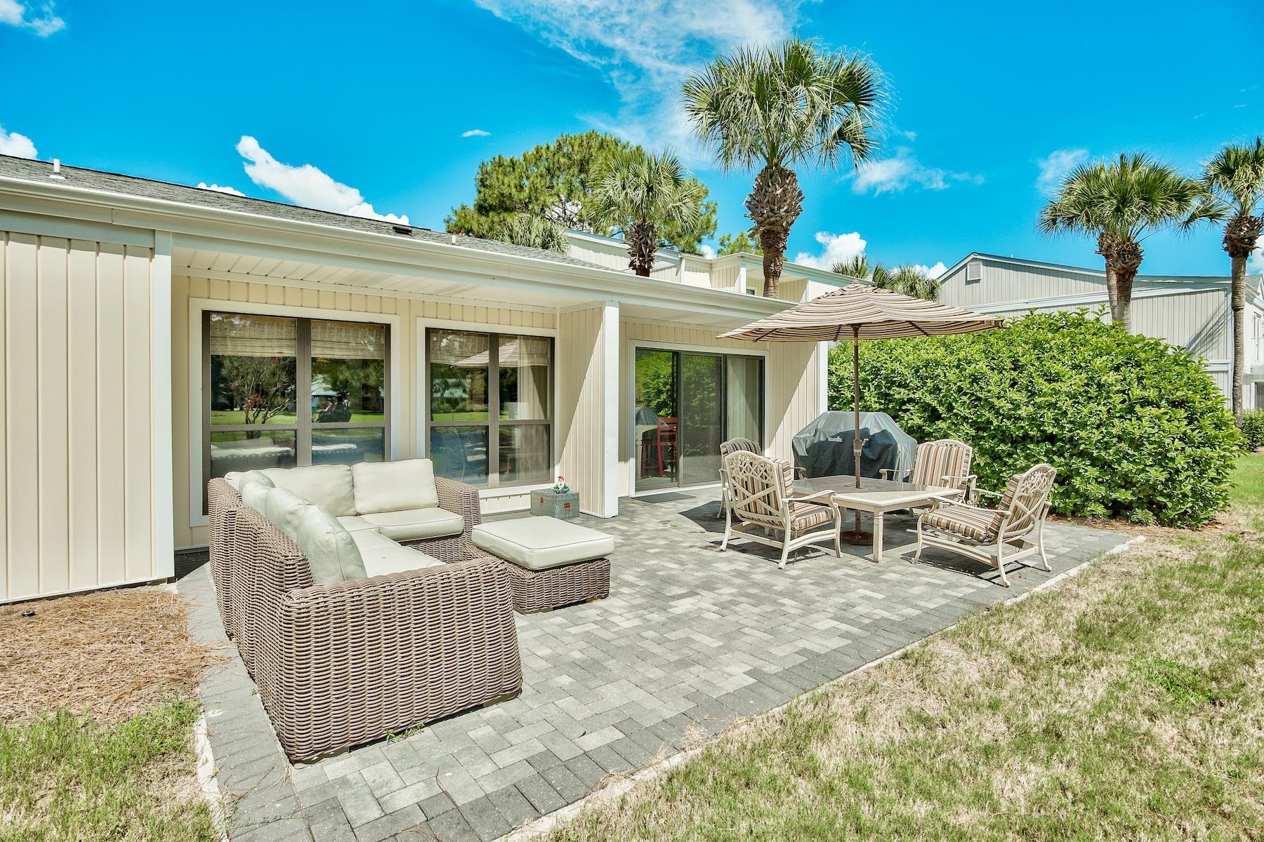 Enjoy all the amenities that resort life has to offer from this charming single story free standing condo with golf course and lake views conveniently located in Sandestin Resort! Fully furnished and ready to move in - this is the perfect place for your full time residence, second home, or investment property! Soft coastal vibes carry throughout the home. The spacious floor plan features two generous living areas, dining area, updated kitchen with custom glaze cabinetry, and an over-sized patio. The two guest bedrooms share a generous sized bathroom. Large storage area outside for beach chairs and more. Your association dues include landscaping, exterior maintenance and insurance, two community pools, daily trash collection, basic cable, deeded beach access, security gates, and more! Conveniently located close to the main entrance of the resort, you're a quick golf cart or bike ride to the most beautiful white sandy beaches, four championship golf courses, a world class tennis center with 15 courts, a 98 slip full service marina, The Village of Baytowne Wharf and Grand Boulevard with all the shops, restaurants, events and entertainment. The only thing missing is YOU!
