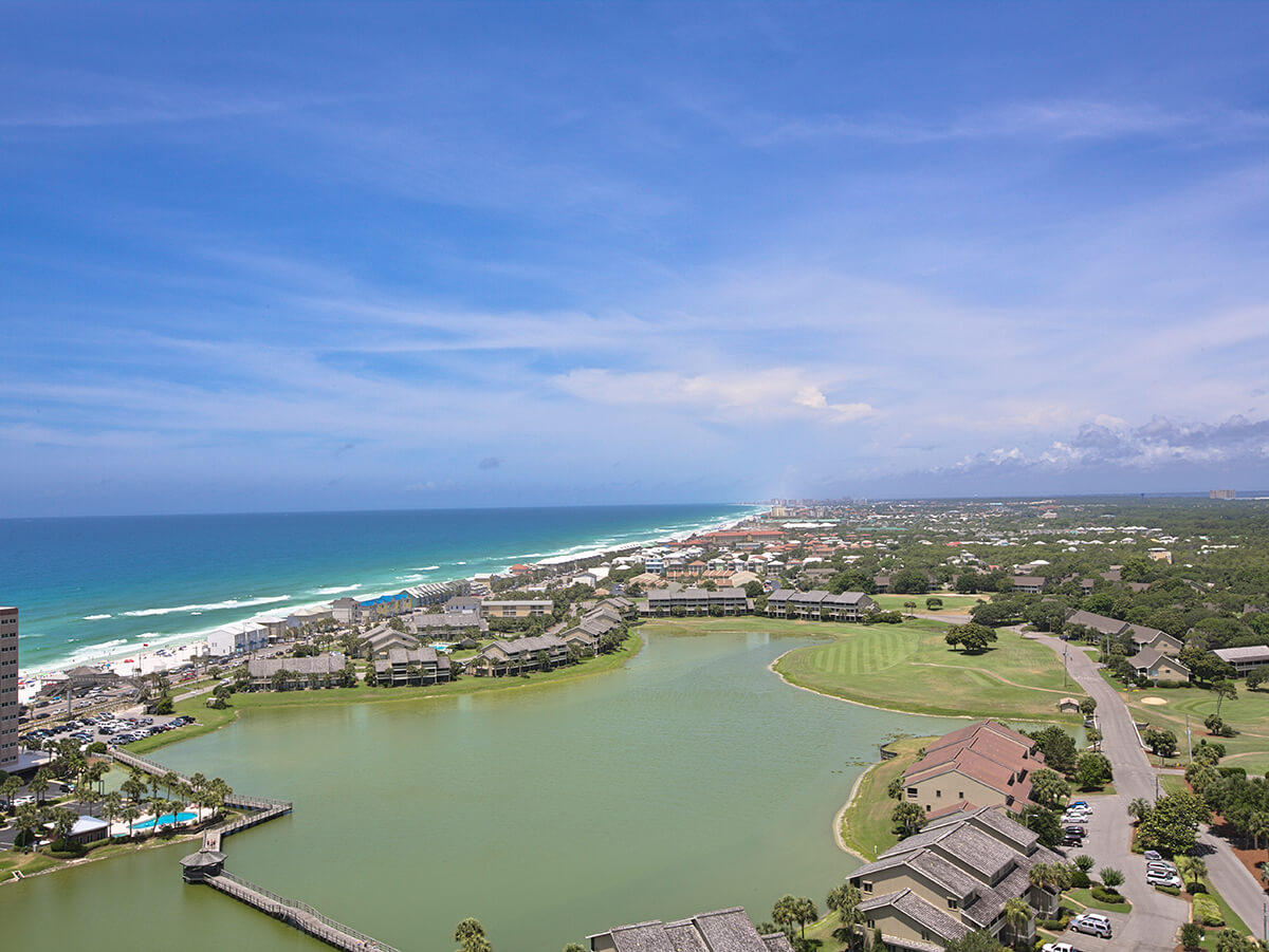 This is a unique opportunity to own the ''Best Seats in the House'' and be completely surrounded by water! Located on the 21st floor and pitched to the SW, you'll have an unobstructed view of coastline sunsets...every day. What's more is the 2nd balcony allows you to watch sunrise and fireworks at Baytowne. This tastefully decorated unit offers not only a coastal contemporary feel, but an openness not offered in most condos. This larger floor plan has considerably greater width in the living area. Tile throughout, stainless steel appliances, granite countertops, crown molding are among the many extras! Buyer to verify all dimensions.