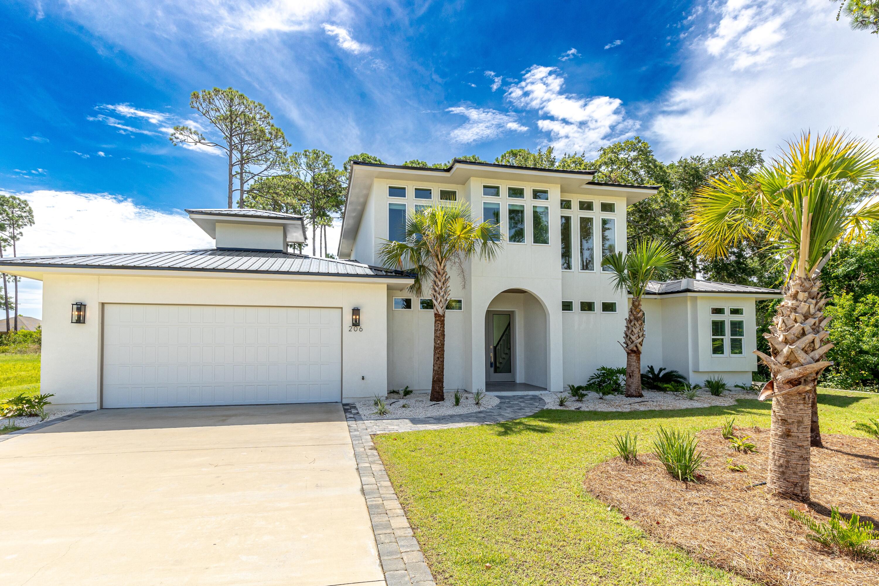 Luxury build with so many upgrades! This custom 3024 sqft Coastal Modern home boasts a large kitchen-living-dining space that leads to a 28' x 10' covered porch with a brand new saltwater pool & hot tub. The open concept living area and outdoor kitchen are perfect for hosting friends and family! A spacious master bedroom is located off the main living space with his/her separate closets, a double vanity and a walk-in wet room with a rain head shower. 1 guest bed with an ensuite full bath is also located on the 1st floor. The open staircase in the foyer leads to a sunny 2nd family room with two additional bedrooms off the back of the home, both with full ensuite bathrooms. Bay sunset views on the 2nd floor.  No HOA, 0.53 acres.