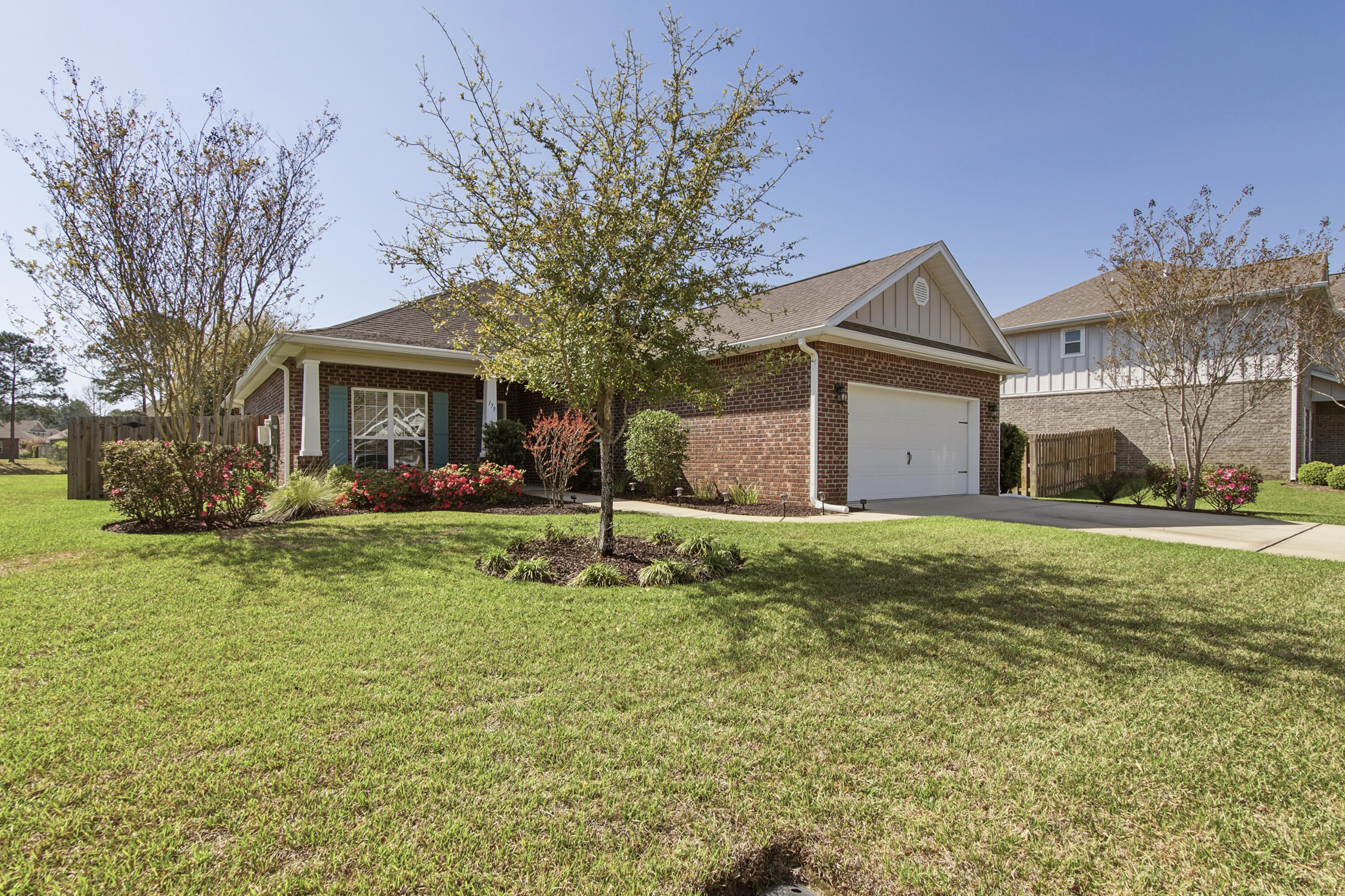 *$10,000 credit to buyer to use for flex cash or rate buy down with acceptable offer PLUS a 1 year 'Shield Complete' home warranty plan through American Home Shield* Welcome to 179 Windchime Way, a beautifully maintained waterfront home located in the highly sought-after Whispers neighborhood of Hammock Bay. Offering a perfect blend of comfort, functionality, and recent upgrades, this spacious 4-bedroom, 2-bath home is designed for both everyday living and effortless entertaining. The thoughtfully designed split floor plan provides privacy and flexibility, while the formal dining room with elegant glass-enclosed doors also serves perfectly as a home office, flex space, or secondary living area. At the heart of the home, the kitchen combines style and functionality with abundant cabinetry, custom tile backsplash, and top-of-the-line stainless steel appliances. The open-concept layout flows seamlessly into the spacious family room, creating an inviting atmosphere ideal for gatherings, holidays, or relaxing evenings at home. Recent seller upgrades add tremendous value and appeal throughout the property, including freshly repainted interiors, custom-built cabinetry in the garage for exceptional storage, durable epoxy flooring in both the garage and covered back patio, and a newly installed iron rod fence that enhances both privacy and curb appeal. Step outside to the covered back patio and enjoy peaceful pond views with no rear neighbors directly behind you.  Whether enjoying your morning coffee, hosting friends, or the waterfront setting creates a serene outdoor retreat. Located within the award-winning master-planned community of Hammock Bay, residents enjoy access to resort-style amenities including multiple pools, fitness center, clubhouse, walking and biking trails, sports courts, playgrounds, community events, and more -- all just minutes from Freeport, the Emerald Coast beaches, and Choctawhatchee Bay.

This move-in ready waterfront home offers the ideal combination of location, upgrades, and lifestyle in one of Hammock Bay's most desirable neighborhoods.