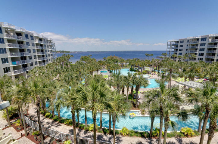 This wonderful end unit condo gives you quick access to either the bay or the famous beaches of the Gulf Of Mexico. Close by is the award winning pool with a lazy river which is just one of many great amenities. Take in the view from either of your private balconies as you decide which nearby attraction you will explore next. One balcony faces the bay and overlooks the pool, the other faces the gulf side. Additional windows let in extra natural light for a more open feel. Vacation in style and rent it out in between visits. Gross Rent- 2014 $25,368 and 2015 $37,203. Buyer to verify all information.