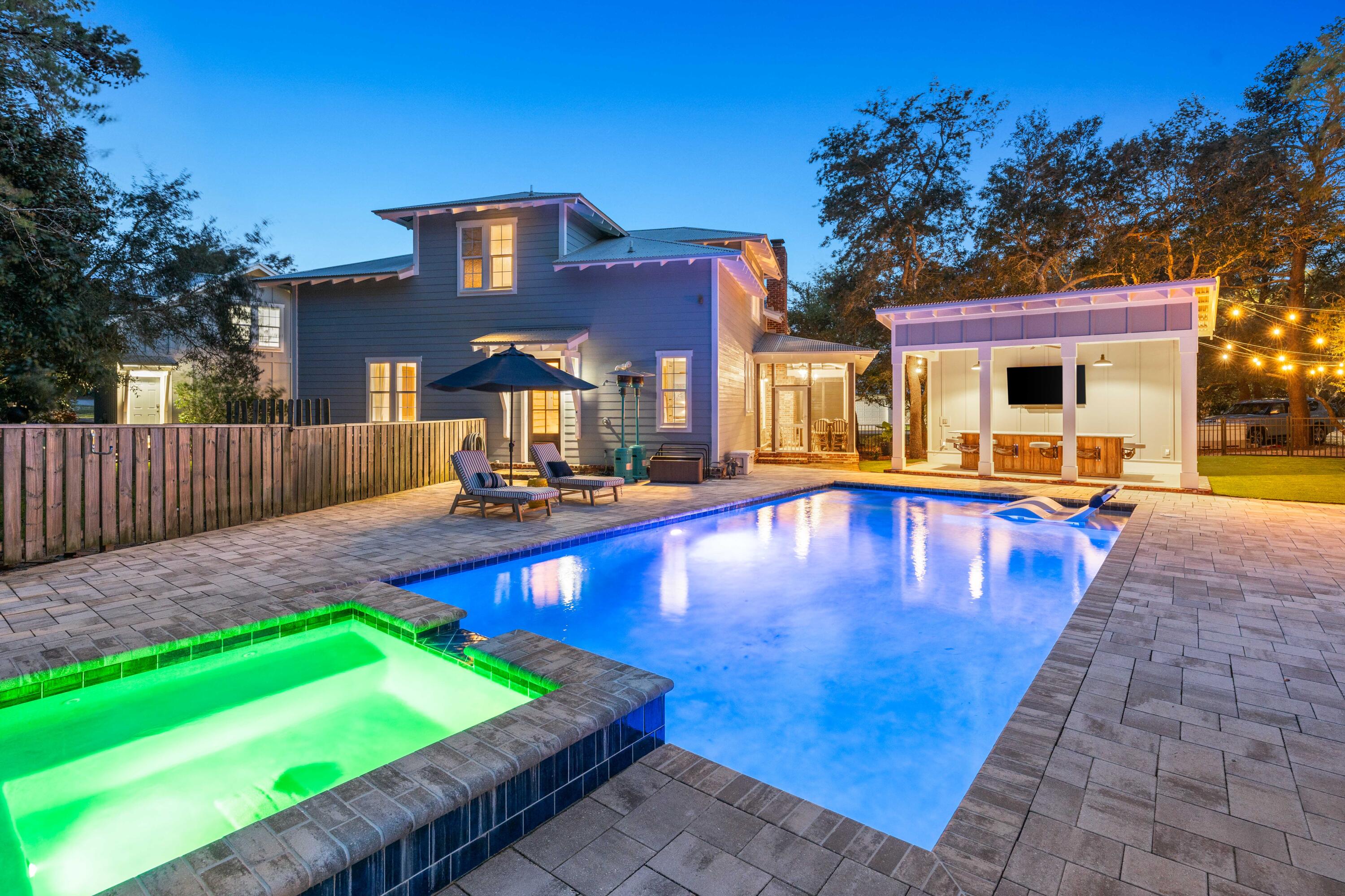 Expansive and meticulously maintained property on a corner lot. Just a stones throw from Van Butler Elementary and the beaches of 30A, this home features 4 bedrooms and 4.5 baths, + office in the main house and an additional bedroom and bath in the carriage house, ample parking and room to entertain with the large backyard area featuring a cabana and a massive 17x34 heated pool with a spa! In the main house, you'll find hardwood floors and 10' ceilings throughout. Upon entry, revel in the expertly blended features such as ship lap and brick walls and a grandeur wood burning brick fireplace. The living kitchen and dining areas all seamlessly flow allowing for no disruptions of time with friends and family. On the 1st floor you'll also find the separate office which has bountiful natural light. The primary bedroom on the main level of the home provides convenience and a luxurious retreat with an ensuite bath containing a sophisticated garden tub, a zero entry shower and a walk-in closet. Upstairs you'll find 3 well appointed bedrooms, 2 of which have their own private ensuite bath. The detached 2 car garage offers additional storage space in the rear, and a carriage house. The carriage house can be privately accessed from the side yard and is self-sufficient with its own kitchen, bedroom, bathroom, laundry, HVAC system and hot water heater.

The West End of 30A in Santa Rosa Beach, Florida, is a charming and laid-back area known for its quiet, scenic atmosphere and beautiful beaches. It offers a peaceful retreat for those looking to enjoy nature and relaxation. You'll find lush dunes, and easy access to the Gulf of Mexico's crystal-clear waters. It's also home to small local shops, cozy restaurants, and art galleries, making it a perfect spot for a slow, easy-going life. Nearby, places like Grayton Beach State Park and Point Washington State Forest offer plenty of opportunities for outdoor activities like hiking and kayaking.