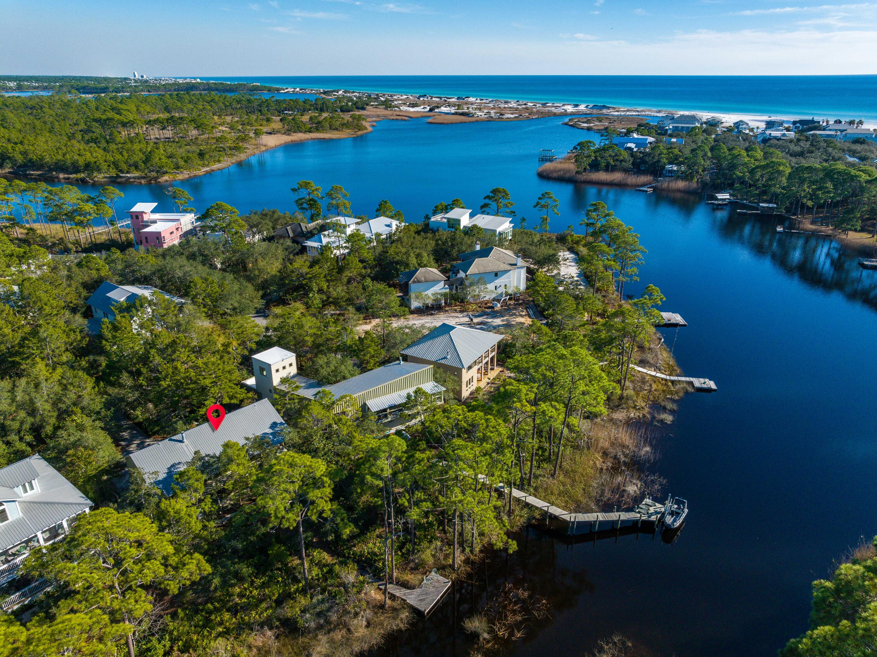 ***We are back on the market through no fault of the seller! With 7000' of uninterrupted, publicly owned Gulf of Mexico shoreline amidst thousands of acres of state park land all within an easy bike, paddle or walking distance, this home, located in the secluded, gated south of 30A neighborhood of The Lake Place in Grayton Beach is the perfect location for beach and lakefront living. Being on Western Lake, one of the largest of the globally rare Coastal Dune Lakes you will enjoy the serenity of your own dock as well as the private community pool, park and large neighborhood dock and entertaining areas. The Lake Place is conveniently adjacent to Grayton Beach State Park and importantly  for full timers or true second home owners, does not allow short-term rentals. You can boat or paddleboard toGrayton beach, The Red Bar and Chiringo or take a short bike ride or stroll to nearby boutique shopping and numerous delicious restaurants, including Borago and Grayton Seafood Co. This unique "dog trot" style home was thoughtfully designed by nationally recognized Sala Architecture for this specific lot and location on Western Lake and offers an open floor plan and living area with an abundance of windows flooding it with natural light and views of the beautiful, wooded lot. The living room provides the enjoyment of a gas fireplace and a spacious (54' long) lakeside balcony that provides an excellent flow for entertaining. An additional living area is located on the first level and there is plenty of room for an addition. If desired, plans are available for a carriage house and garage. The Lake Place is a 20 acre property on the beach side of 30A surrounded by State park and Western Lake. Enjoy the serenity of nature and the very best of 30A living in this convenient, yet quiet Grayton location.