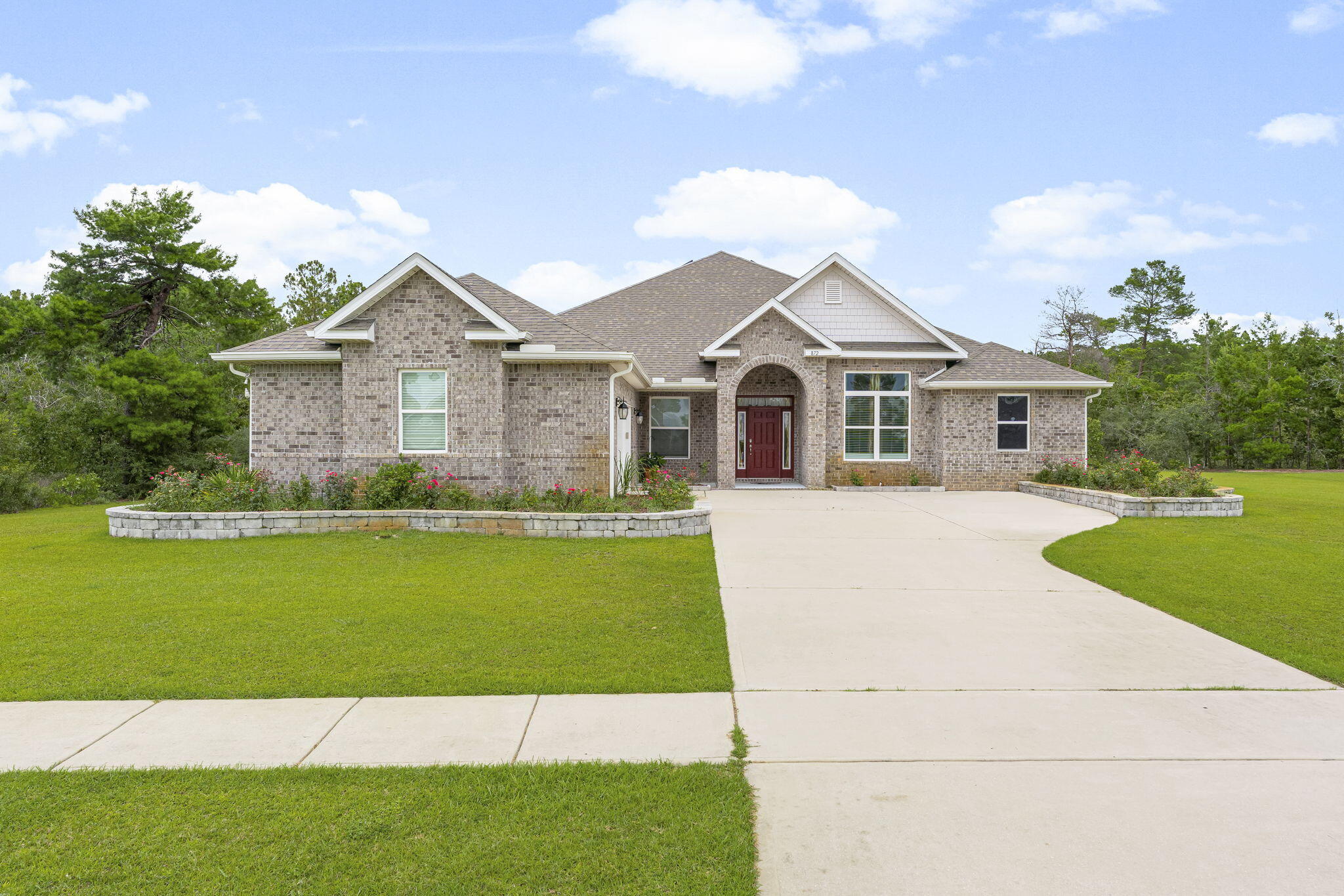 Elegant Home on 1 Acre - Step into this beautifully appointed 4-bedroom, 3-bath home set on a private 1-acre lot. The open layout features a welcoming foyer, elegant dining room, and a spacious great room flowing into a gourmet kitchen with granite countertops, stainless steel appliances, and a large center island—perfect for entertaining. A flexible bonus room offers space for an office or media room. The split floor plan includes a luxurious master suite with a sitting area, plus three guest bedrooms and two additional full baths. Enjoy indoor-outdoor living with a screened-in porch, fully fenced and sodded backyard, and a covered pavilion with a cozy fireplace—ideal for year-round gatherings. With room to add a pool, garden, or play area this outdoor space is ready for your vision.