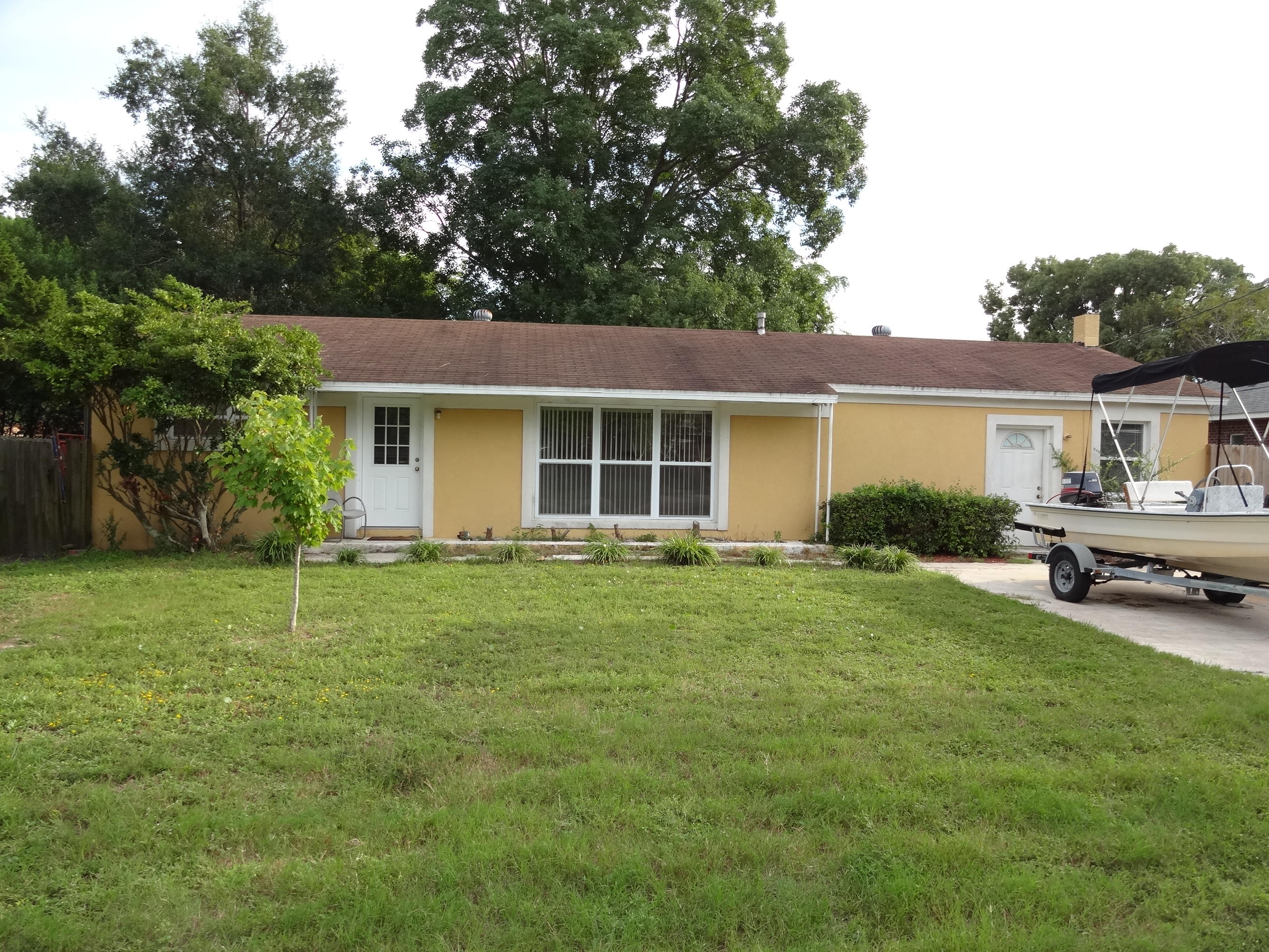 Short Sale. Three Bedroom two bath home features a very livable floor plan. Tile floor throughout living room, dining area and kitchen makes this home easy to maintain. Previously brick, the home now has a stucco finish. A large 12' x 19' family room has French doors leading to the dining area. And the dining area is open to the living room. A laundry room is located just off the family room (this room currently is being used as a fourth bedroom). The backyard is fenced and has a deck as well as a 12' x 19' workshop with electricity.