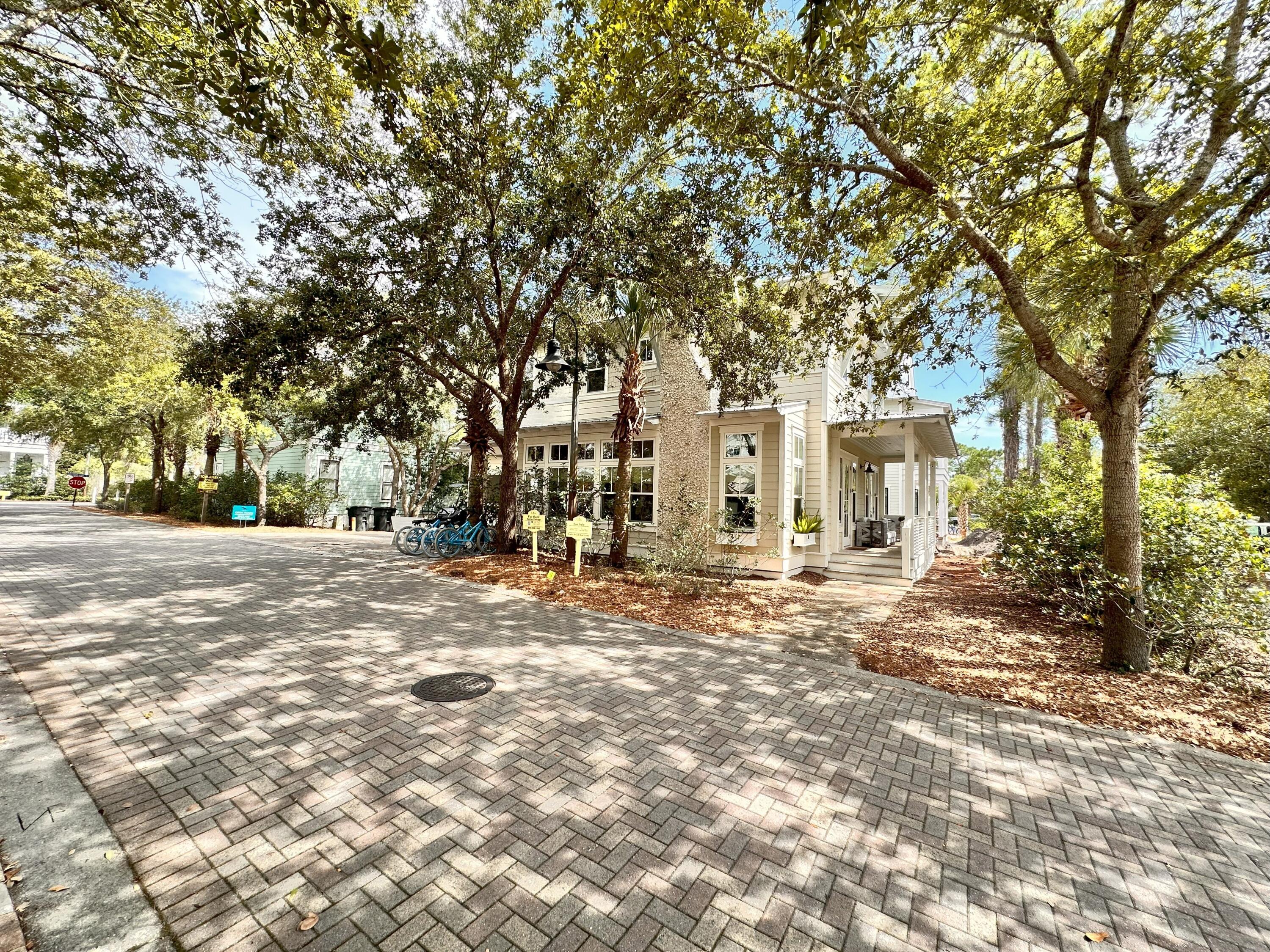 Oyster Cottage, located in Seagrove Beach in the Cottages at Eastern Lake, is a beautifully crafted custom home offering upscale coastal living south of iconic 30A. A spacious front porch invites you into an open, light-filled floor plan where the kitchen and living areas blend seamlessly. The living space is accentuated by exposed wood ceiling beams, wainscoting, and a stunning natural stone fireplace. Rich maple wood flooring extends throughout the main floor, enhancing the home's timeless charm. Completing the 1st floor is a spacious primary suite, a half bath and laundry room. Three public beach accesses, two with expansive public beach and a public launch point on Eastern Lake provide ample opportunities to enjoy the beautiful beaches and rare coastal dune lakes of the Emerald Coast The kitchen impresses with clean white cabinetry, gleaming quartz countertops, and premium stainless steel appliancesincluding a gas range and French-door refrigerator. Just off the living area, you'll find a convenient half bath and a laundry room on the main level.
This beach retreat features two luxurious primary suites, each with a private ensuite bath. The first is located on the ground floor and includes a king bed and access to a peaceful, curtain-draped back porch. The ensuite offers a walk-in tiled shower, double-stone vanity, and ample natural light. Upstairs, the second primary suite is framed by large windows behind the king bed and showcases a cypress wood ceiling. The ensuite bath includes a walk-in shower with built-in bench, double-stone vanity, and a generous walk-in closet.
Also upstairs is a guest bedroom with a queen bed, shiplap accent walls, and its own ensuite featuring a double-stone vanity and glass-enclosed tiled shower. A spacious bunk room with two twin-over-full bunk beds sleeps six and completes the upper level.
As part of the Cottages at Eastern Lake, owners enjoy access to a palm-lined resort-style pool and Eastern Lake for kayaking, canoeing, or paddleboarding. Three public beach accesses and Deer Lake State Park are just a short bike ride away, and the Eastern Lake boat ramp is just a two-minute walk from the home. Dining spots, coffee shops, an ice cream parlor, seafood market, and other local boutiques are within easy walking distance on the north side of 30A.
Ideally positioned just minutes from Seaside, Alys Beach, and Rosemary Beach, this property offers a true 30A lifestyle. The home is offered fully furnished with only a few personal exclusions. The seller has relocated and is open to all reasonable offers. Schedule your private showing today.