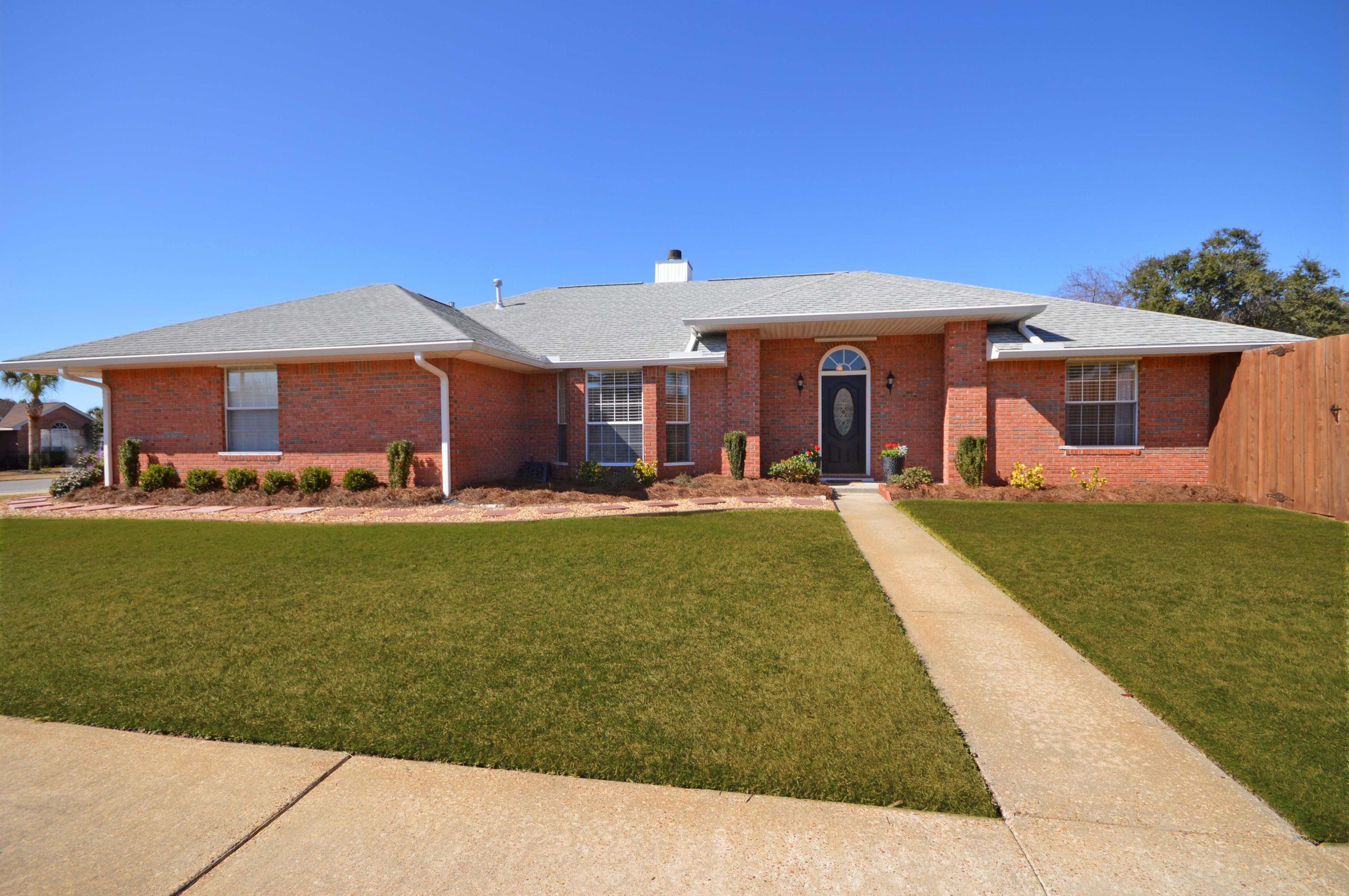 Beautiful home in Ridge Wood Manor Subdivision located in the heart of Destin. Close to the Gulf, bay area and Harborwalk. Great home for entertaining. Walk in the foyer to see new 20'' porcelain tile through out the entire living space, dramatic ceilings in each room. The living room has a large bay window and a see through gas fireplace with a new tile surround. The spacious master bedroom has new carpet, a large walk in closet and a trey ceiling. The master bath has a new garden tub with tile surround, his and her sink and a stand alone shower. Updates in the kitchen include all new LG stainless steel appliances, a double oven and new granite counter tops.
The lot is one of the largest in the subdivision and has an 8 foot high privacy fence enclosing an in-ground heated pool.