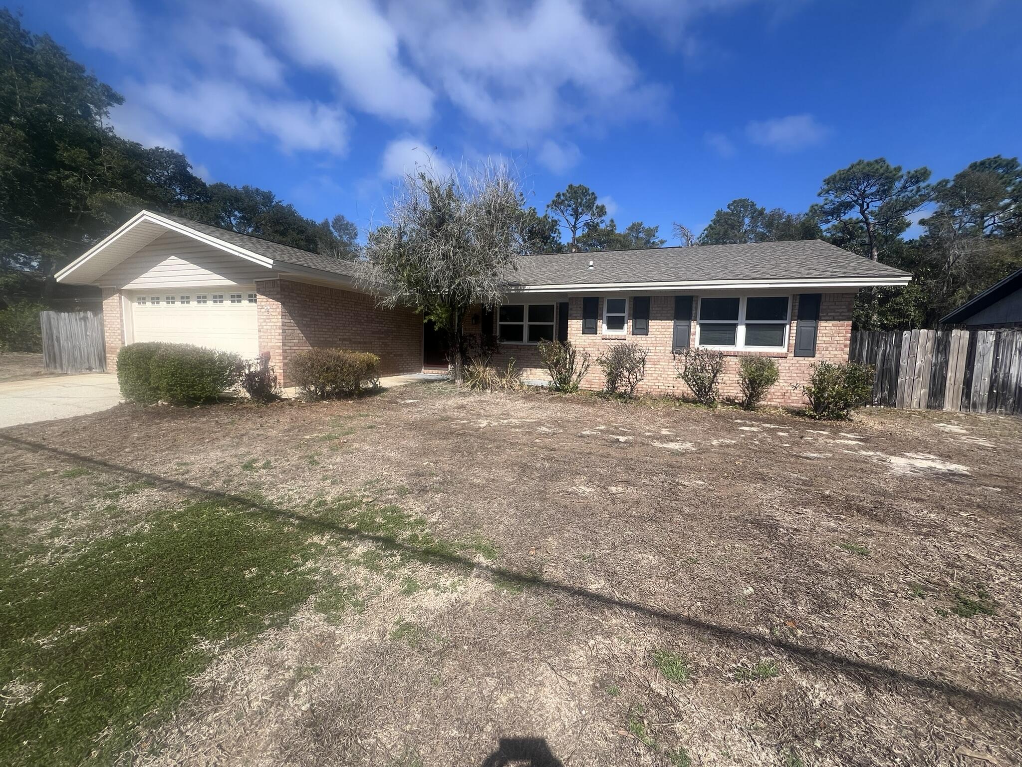 Centrally located. All brick 3 Bedroom 2 Bath home with ample parking and plenty of storage.
Great floor plan - open kitchen looking over the spacious living area with fireplace. Separate dining room with plenty of privacy. Home backs up to Eglin reservation. Home has 2 large storage buildings in the back yard and two car garage. Home is rental ready with much TLC from the homeowners - new carpet, fresh paint and so much more.