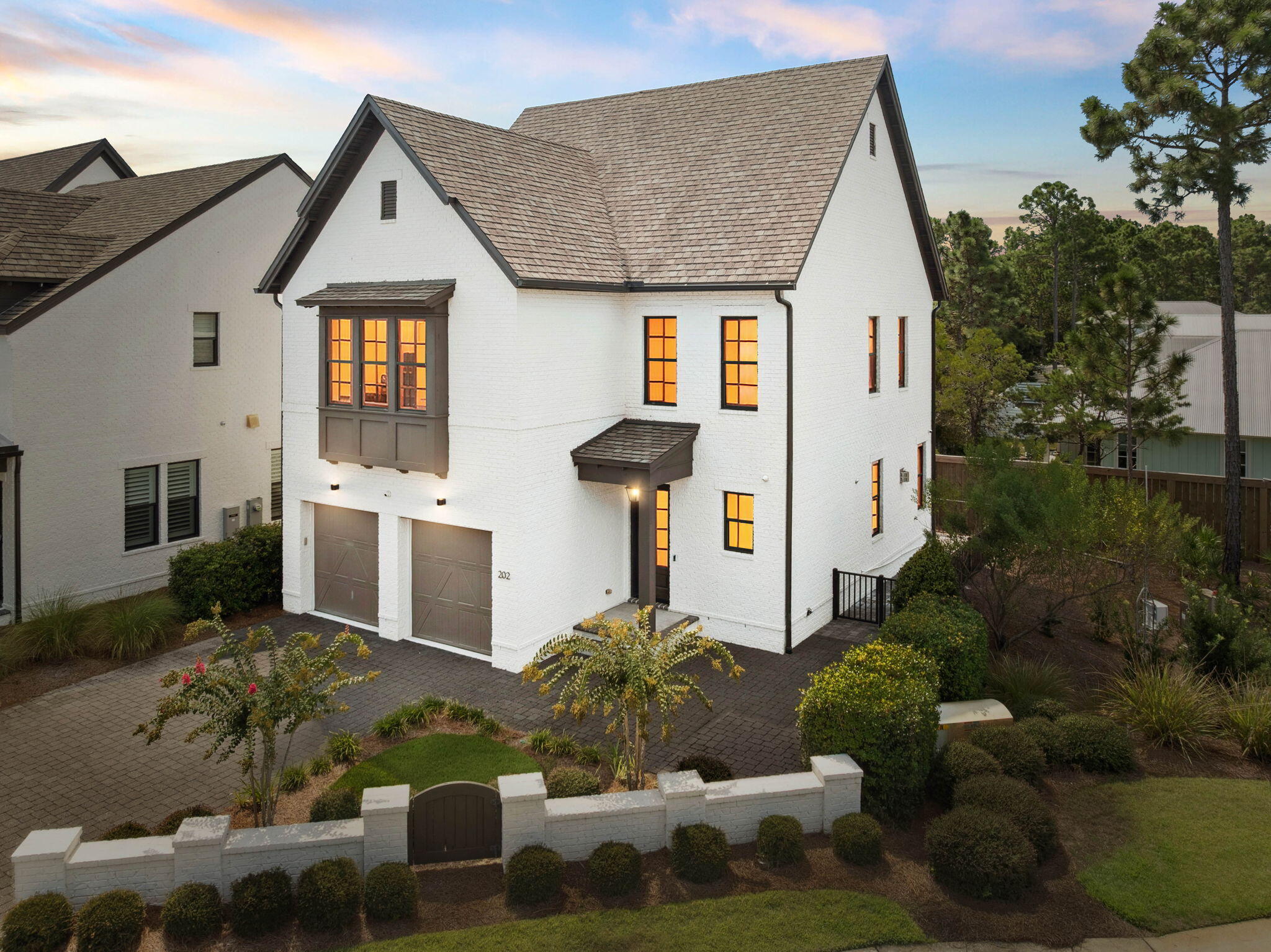 Priced to Sell in RidgeWalk!  Welcome to 202 RidgeWalk, a stunning corner-lot home in the highly sought-after gated community of RidgeWalk, just a short stroll to the sugar-white sands of 30A, Gulf Place dining, and boutique shopping. This non-rental property offers exceptional privacy with a fenced yard, perfect for your furry friends, and low-maintenance turf along the side of the home.
Inside, the open and bright living space is designed for both comfort and entertaining. The living room features wood beams and a cozy fireplace with a white brick surround. The chef's kitchen boasts quartz countertops, an apron-front sink, gas cooktop, spacious island, and a convenient dry bar with abundant storage and beverage fridge. An office nook on the first floor provides the perfect space to work from home. Double glass doors open to the back yard, ideal for grilling or dining al fresco.
Upstairs, the expansive primary suite is a true retreat with room for a cozy sitting area, a custom walk-in closet, and a luxurious bath featuring dual vanities, a soaking tub with decorative tile wall, and a separate shower. The 2 additional guest suites share a Jack-and-Jill bath with double sinks.
The coveted two-car garage with epoxy floors adds functionality and style.  With plenty of room to also park in the driveway. 
This move-in-ready home blends thoughtful details with a prime location near the beachdon't miss your chance to make it yours!