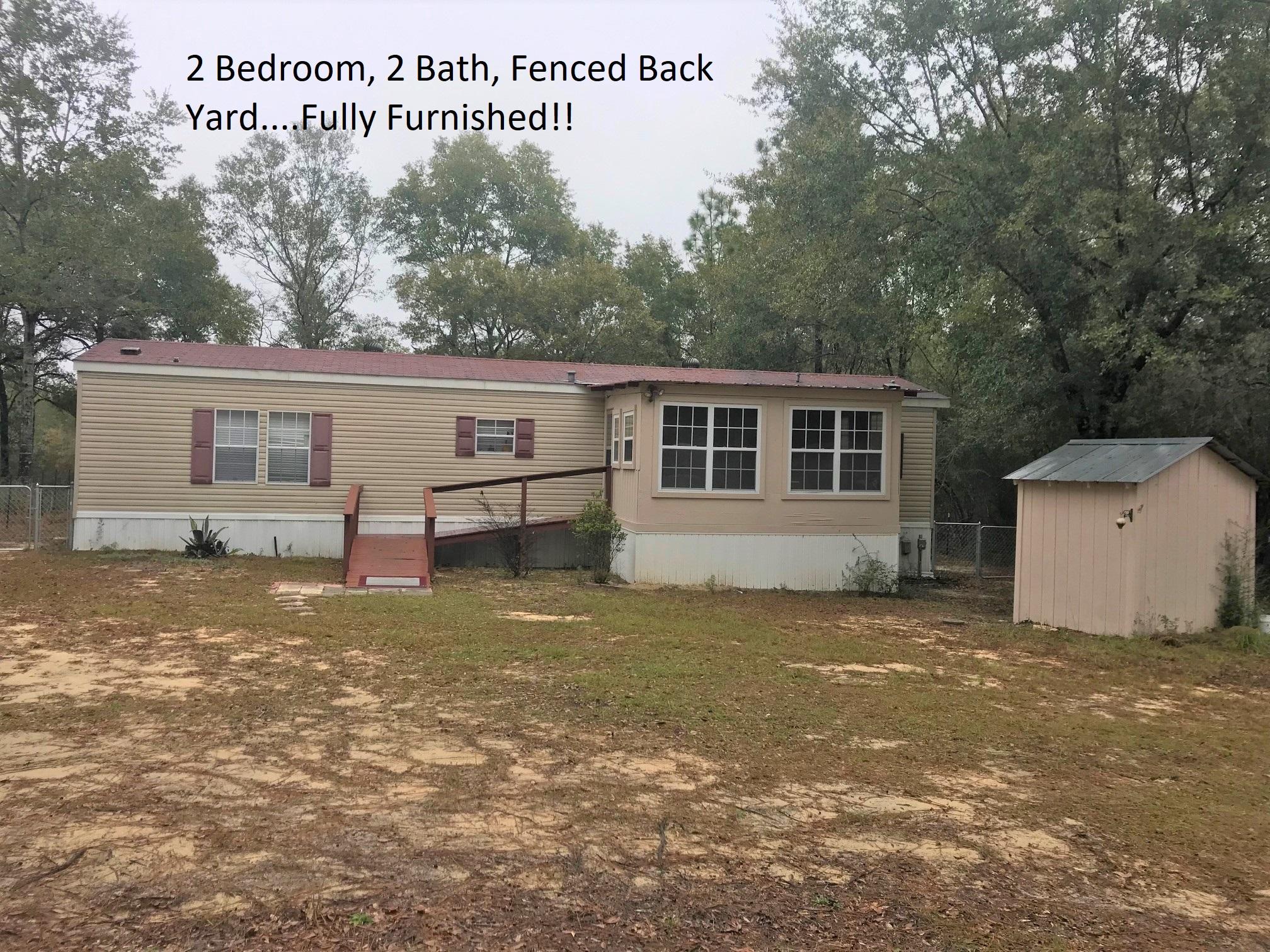 Great buy on this 2 bedroom, 2 bath 2006 single-wide manufactured home just 5 minutes outside of town. This home comes fully furnished PLUS all appliances (washer, dryer, refrigerator, microwave, stove, dishwasher)! Just move right in, or would make a great rental! Open floor plan; 1 BR, 1 bath at each end of home, New HVAC installed Oct. 2018; 12x16 enclosed porch; fenced back yard and storage shed with power in back yard. Home is on well and septic. Schedule your showing today!