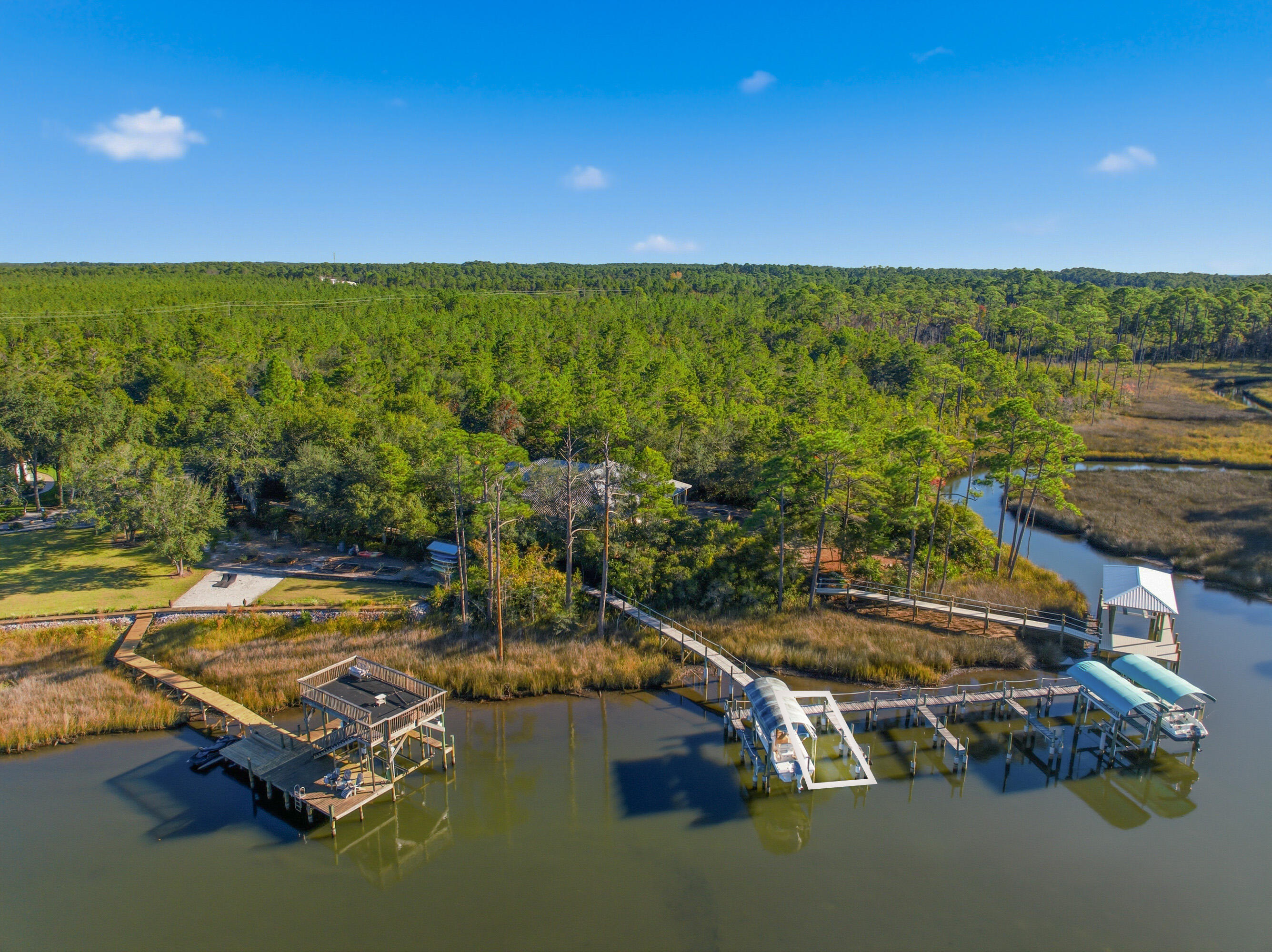 Beautiful manicured lot with BOAT SLIP INCLUDED. Boat slip is maintained by the HOA but new owner will have use and personal access to it. This Lot is mostly cleared and in an ideal location. Backing up to conservation land that provides the ultimate privacy while being minutes to the shops and dining at Grand Boulevard, Sandestin, Publix, 30A and Sacred Heart Hospital. This lot comes with an assigned boat slip on Hewitt Bayou offering direct access to the Bay that is less than 1/4 mile. Great location for somebody that enjoys being on the water, and also a nice quiet, low density,  private neighborhood. The Lot is located in flood zone X. Lot dimensions are approximate and should be verified by buyer.