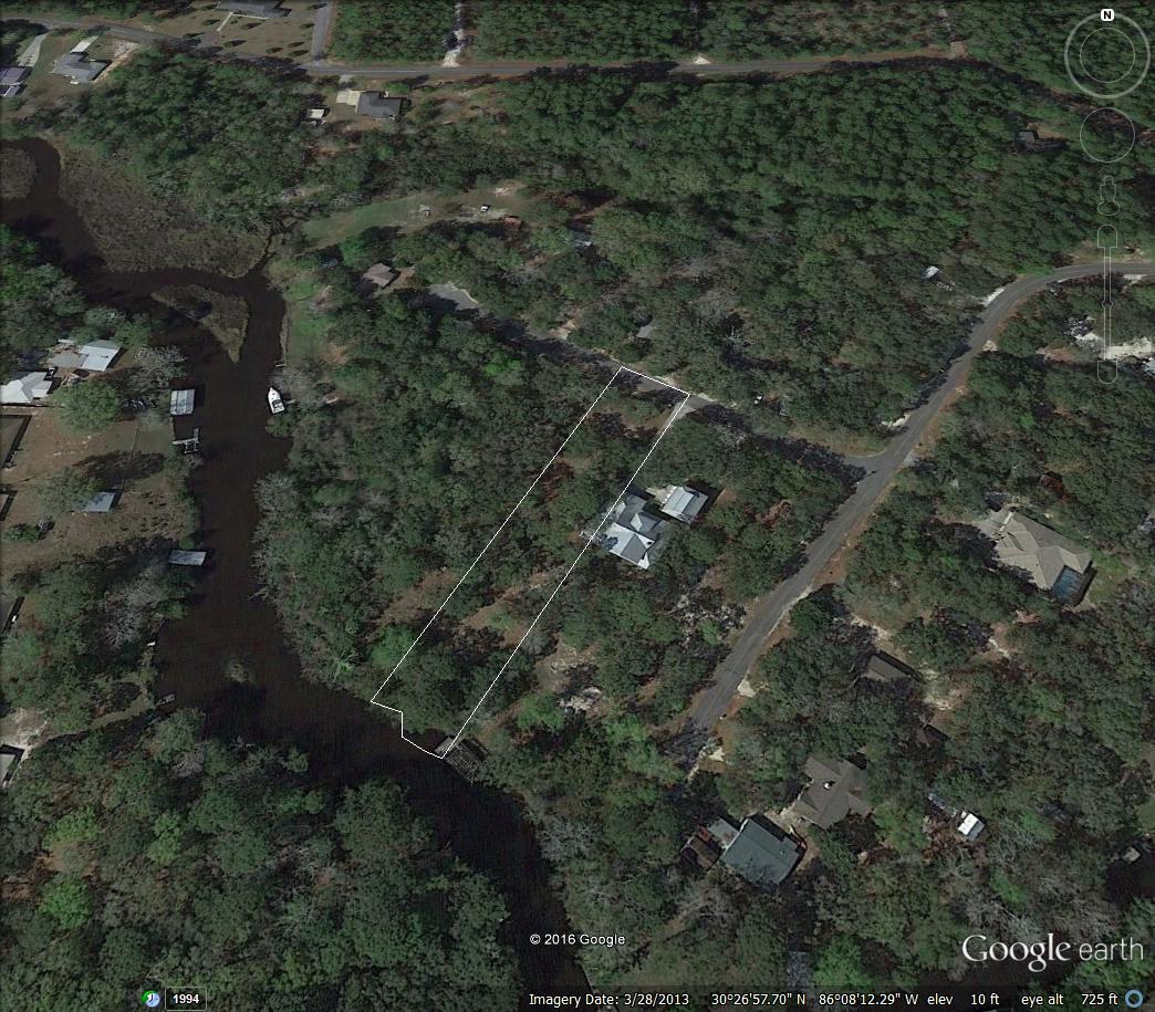 Beautiful waterfront lot with access directly to the bay. If you are searching for a waterfront lot to build your dream home this is the one. Partial cleared and ready for building. The lot is over .68 acres and has over 77 feet of waterfront. The lot has large canopy oaks and plenty of room for all you've been wanting. The property is located on a paved road and near the beaches.
