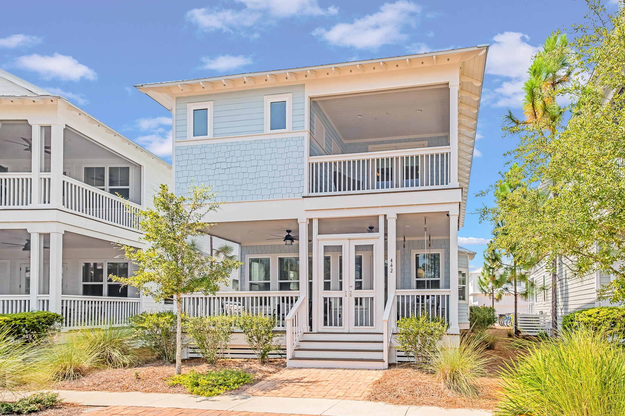 Welcome to your fully furnished, turnkey 4-bedroom home in the sought-after NatureWalk at Seagrove community. This is the best-priced 4 bedroom with a rare 1 car garage in the area! You'll love the dual primary suites, one of which is conveniently located on the first floor. The home is just a few doors down from the pickleball courts and a swing set and green area, making it the perfect location for families.
This home has a proven track record of success with $72,000 in rental income. Relax and take in the scenery on one of two porches, with the first-floor porch offering a porch swing for those lazy days. The spacious and bright living room features wall-to-wall windows that open to the kitchen and dining area. The dining area has an oversized table that's large enough to fit all your guests for a family dinner!
The kitchen boasts white shaker cabinets with beautiful glass uppers, quartz countertops, a tile backsplash, and a gas cooktop with a built-in microwave and oven. The first-floor primary suite has two closets, one of which is used as a lockout. The bath features double sinks and a separate soaking tub and tile shower.
This alley-loaded home offers a rare one-car garage and paved parking enough to fit three cars. There's also an outdoor shower in the back of the home with a shower surround to rinse off after a day at the beach. Upstairs, you'll find three more bedrooms and an open loft area with a pull-out couch - the perfect spot for watching TV or playing games.
The second upstairs primary suite is spacious and offers a cozy, private screened porch and a great bath with another soaking tub and shower. NatureWalk at Seagrove is the place to be, with easy access to all the fun in Seaside and Watercolor and biking distance to the beach. The community features amenities such as a trail to the beach, The Gathering Place, lap pool, beach entry pool, hot tub, fire pit, grills, plenty of seating, and a playground.
Other community amenities include Energy fitness stations, multi-purpose courts, and trails throughout. This dual primary suite home has a rental projection of around $80k. Don't miss out on this fantastic opportunity to own a turnkey home in Seagrove Beach - contact us today to schedule a showing!
