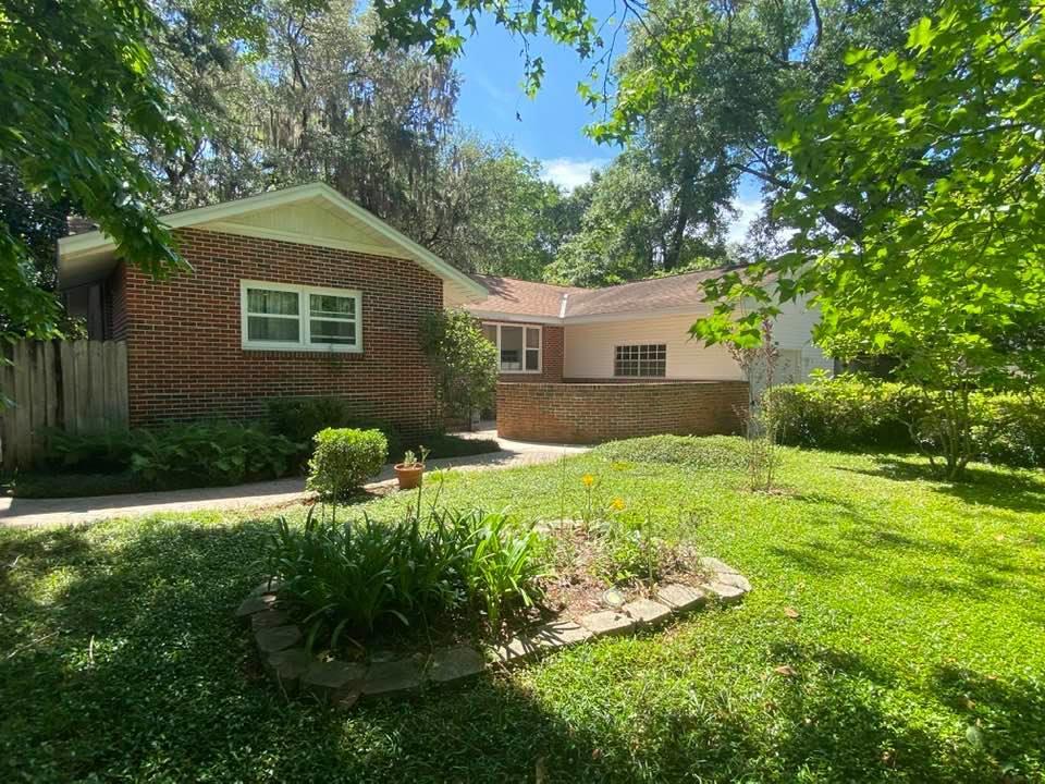 This home is a MUST SEE! 5 bed / 2 bath home with fully fenced low maintenance yard, mature trees and professional looking landscaping in the front and back. The front of the home features a large stone paver patio with ample room for entertaining. Freshly painted interior and beautiful hardwood flooring in many areas of the home. A large picture window brings in soft natural light into the front room. The dine-in kitchen offers the flexibility of using the front room as an additional dining area or second family room. Bedrooms feature hardwood floors and ceiling fans for extra comfort. The largest of the five bedrooms has new carpet and built in bookshelves. The family room has sliding glass doors that lead to beautiful landscaped and well shaded backyard. Gas water heater and water softener system are one year old, copper wiring, newer windows in some of the bedrooms, updated guest bathroom. Zoned for highly sought after Niceville schools and convenient to parks and boat launch --  this home is in a great location! Schedule a showing for this one of a kind home today!