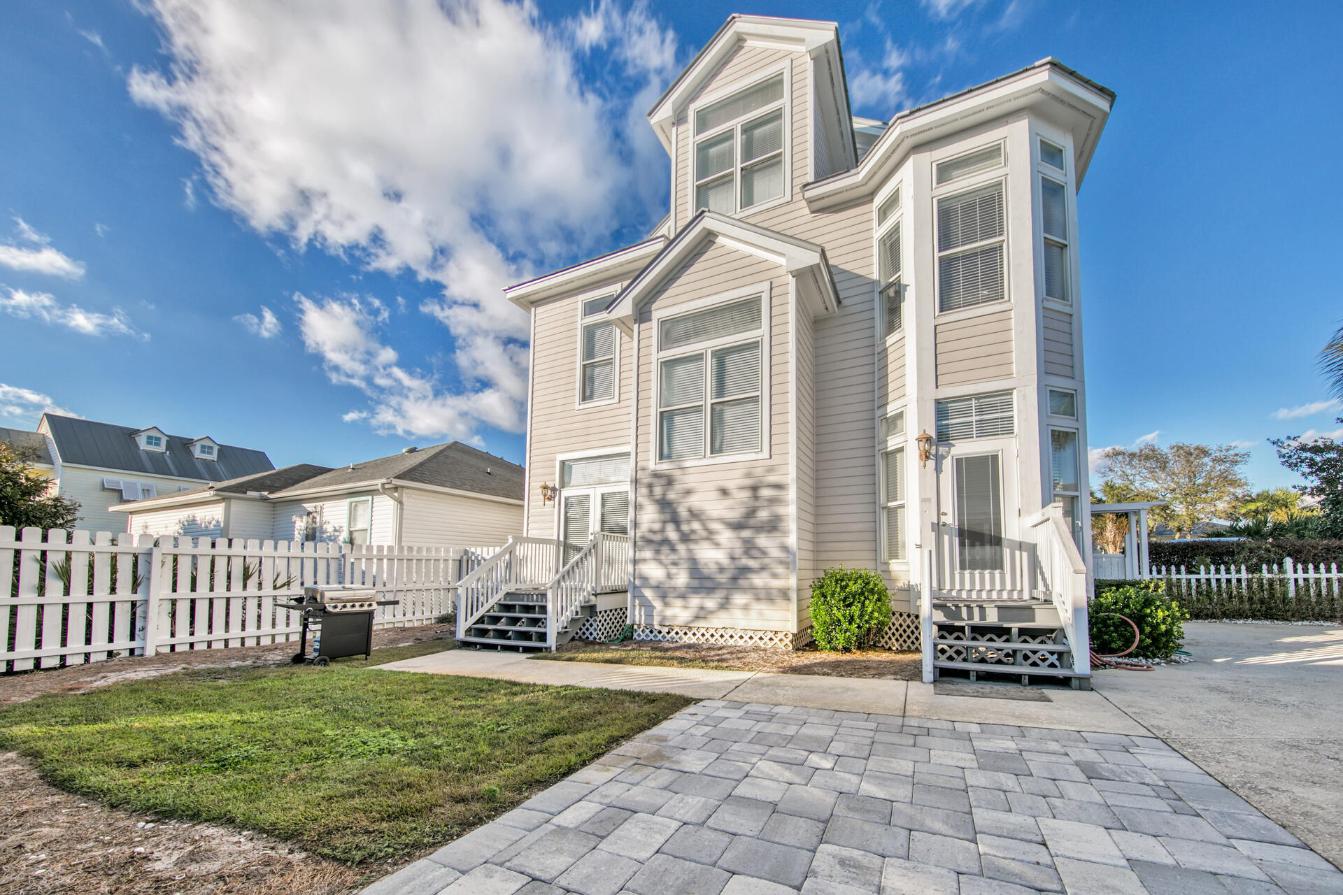 A quintessential beach house just two blocks to the beach is complete with a white picket fence in Crystal Beach Cottages...which conjures of images of sun splashed days biking and walking to the beach. Two bedrooms, a full bath, laundry room, owners closet, fully equipped kitchen, dining, and living area make up the first floor of this amazing home. On the second floor, the master bedroom is accompanied by a large suite featuring double vanities, jetted tub, and walk-in shower. The third floor features a large sleeping area with twin trundle and king bed along with a full bath. Private pool, grill area, and outdoor shower can be found completely fenced in amongst a tropically landscaped exterior with a large sundeck for alfresco dining and entertaining. Come see this amazing  TOP producing vacation rental at the beach which can sleep up to 18 people!