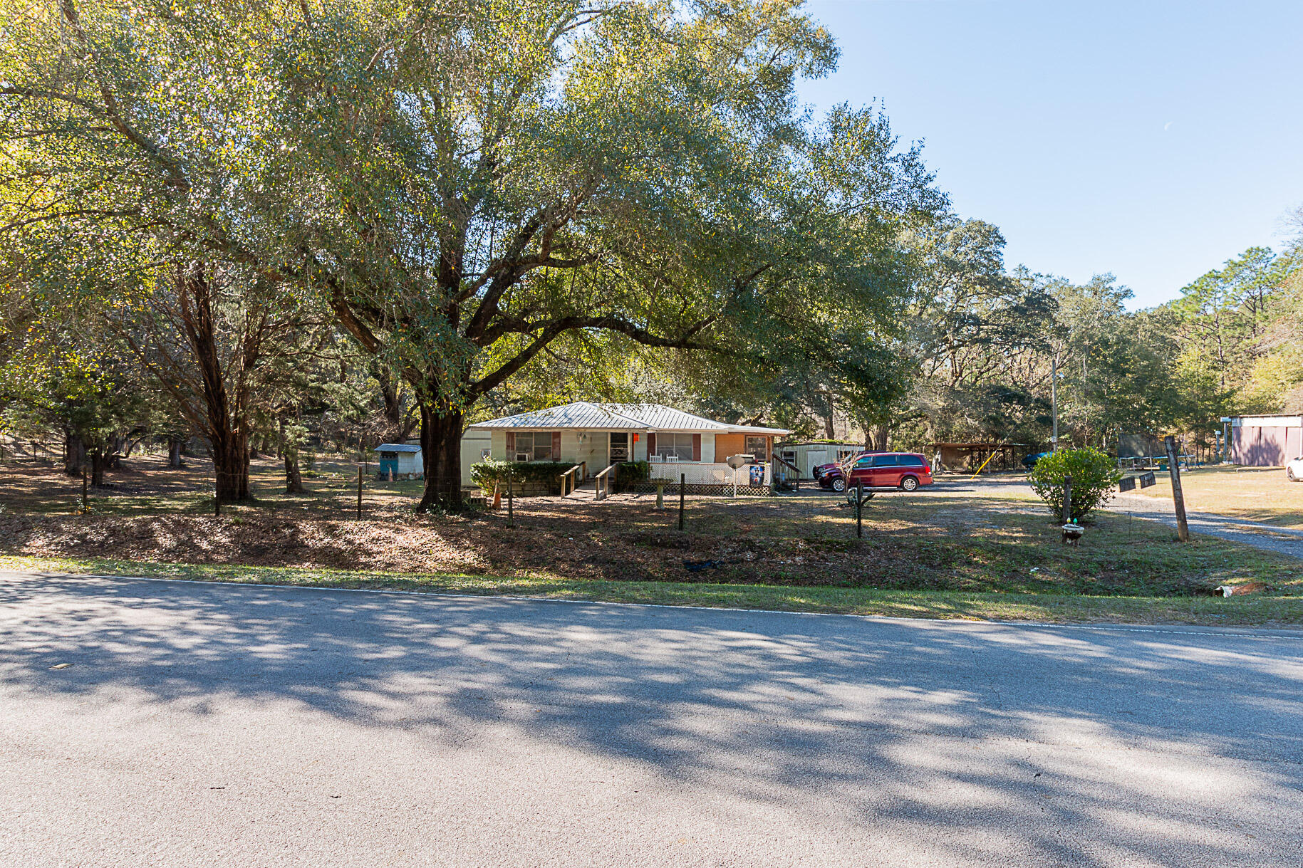 Here is your chance to get Peace, Tranquility and Privacy. Come live on the 2.31 acres which provides a rural lifestyle which restores the mind and spirit.  You have a small pond on the property for your use. This is a small home built in 1962 which has been durable and provides an opportunity for a buyer to add their own touch and updates. Plenty of space for gardening, room for children to play and much more. There is 1 large shed and 3 smaller sheds great for storing items. The sheds convey with no value to the house. This home is close to Defuniak Springs and Ponce De Leon. Come claim your own piece of Paradise.