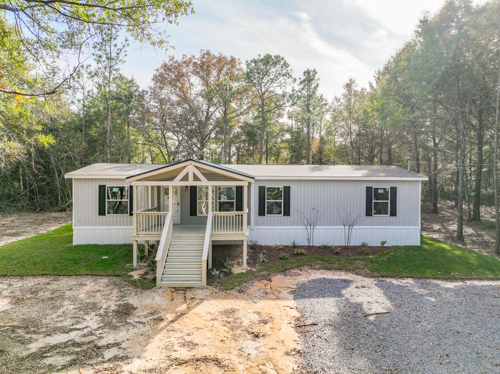 Welcome to Turkey Creek Woodlands! Seller is offering up to $5,000 towards buyer closing costs! Home warranty is included! The lots are over 1 ACRE! A large custom covered porch adorns this NEW 2023 Clayton Expedition home! The home perfectly combines elegance and functionality. This 4/2 top-of-the-line home comes with a modern, open-concept floor plan boasting 1,580 square feet of living space. This home was designed for comfort and convenience, built with the highest-quality materials and meets strict energy-efficient standards. Features include Duracraft cabinetry, Frigidaire appliances and Shaw® Laminate Flooring. Save thousands on utility bills with a well and septic tank! Conveniently located within 30 minutes to most of the military bases and Crestview/DeFuniak! Call today!