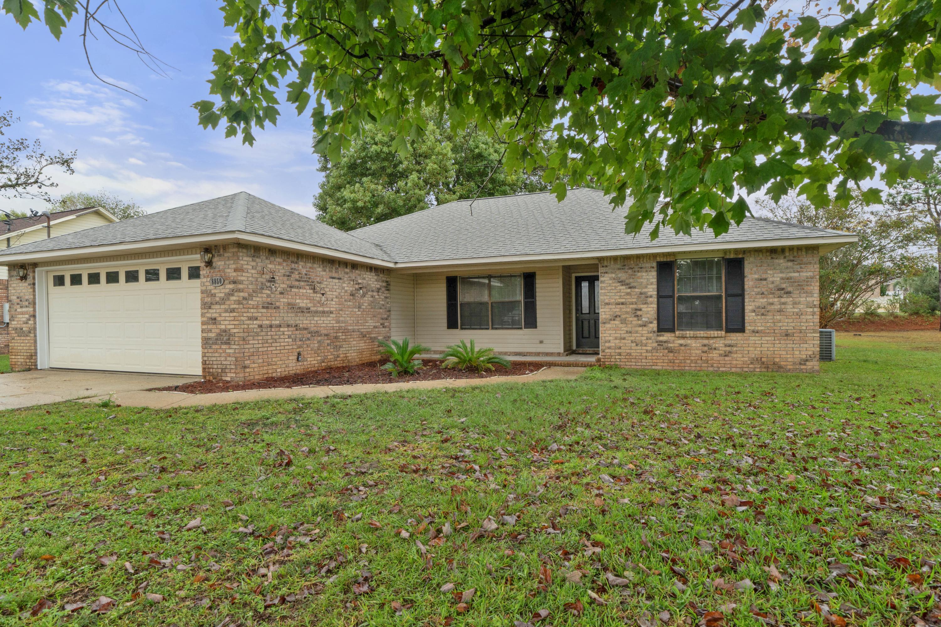 Wonderful brick ranch with a large yard and 2 car garage. This home has recently been repainted to include the trimwork and doors. ALL NEW carpet has been installed too. The home has a great open floor plan with split bedrooms, 2 on one side, and master on the other side. This home has an ample sized living room with stone fireplace overlooking the dining room and rear backyard. The master is near the kitchen just off the living room and overlooks the landscaped backyard. There is a lovely master bath en suite. The two additional bedrooms share a full bath with tub/shower surround.
The kitchen overlooks the dining area and living room, and features stainless appliances and new range hood.