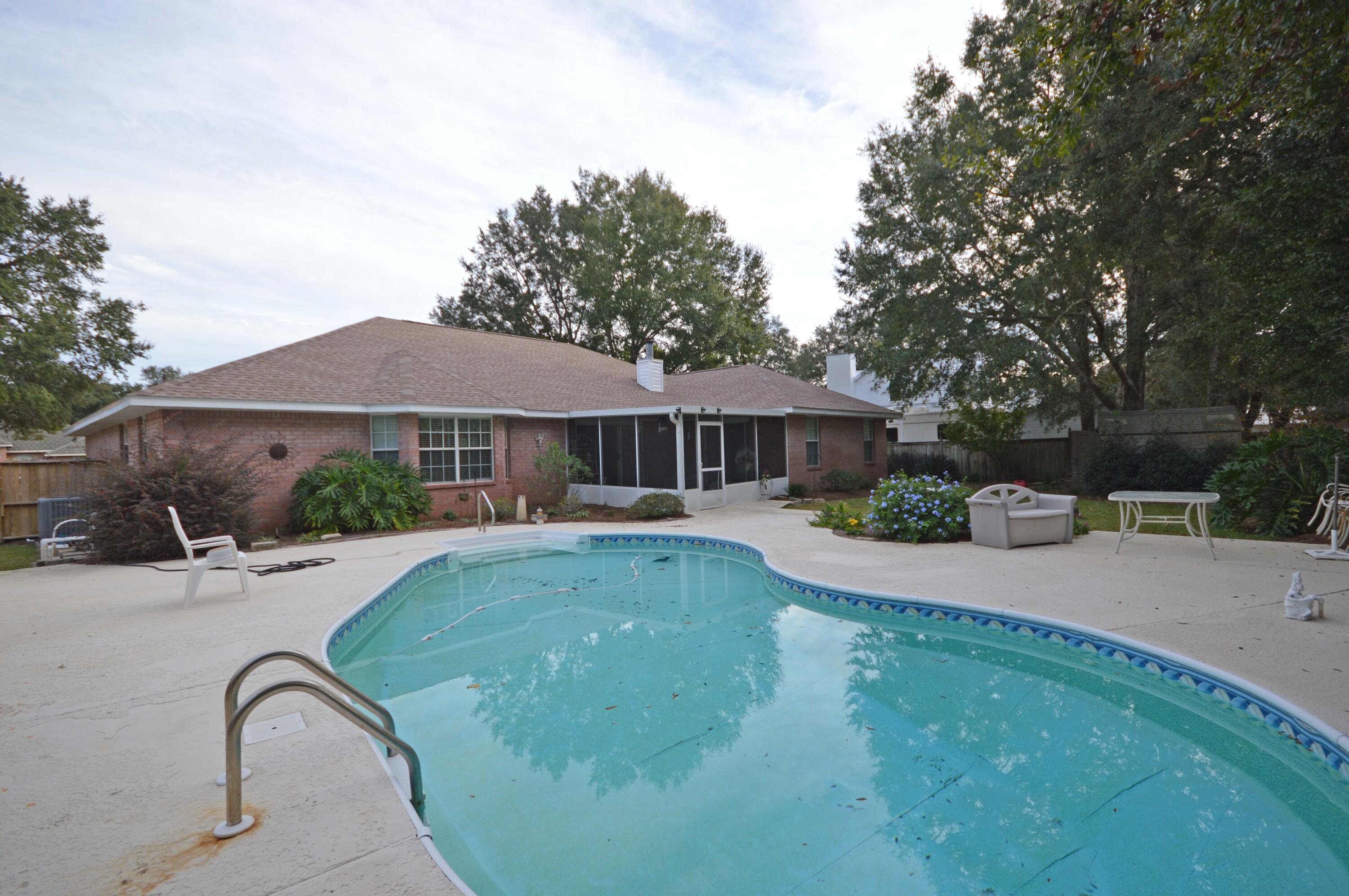 POOL home, New Roof 2020, new flooring! Welcome to the Southern Charm of Robledal Estates! Impressive Custom Built Home with Gorgeous Kidney Shaped Pool and beautiful private backyard; Home has Bull Nose Corners, Orange Peel Wall Finish and High Ceilings Throughout. Entry into the Foyer you will find Neutral Ceramic Tile Floor, Open to Great Room and Formal Dining. Formal Dining Room new LVP;  Large Floor to Ceiling Eye-brow Window, Chandler with Tray Ceilings and Plant Ledges. * Great Room Boast Vaulted Ceiling with Lighted Ceiling Fan, Plant Ledges. Tiled Wood-burning Fireplace! Open to Formal Dining Room; Kitchen has NEW granite countertops, new shaker white cabinets with Coat Closet, New Vinyl Floors, Desk Area and Island with Sitting Area, Great for Kids to Help with Cooking;  Sliding glass doors; flow to the enclosed tiled sunroom which leads to beautiful Pool Area;  CRAB Inc is close and has a small beach and boat ramp area; An optional one time fee allows owners to have access to the beach, dock, and boat ramp on the bay. Neighborhood gatherings happen at CRAB INC on Friday evenings. Come view this home!