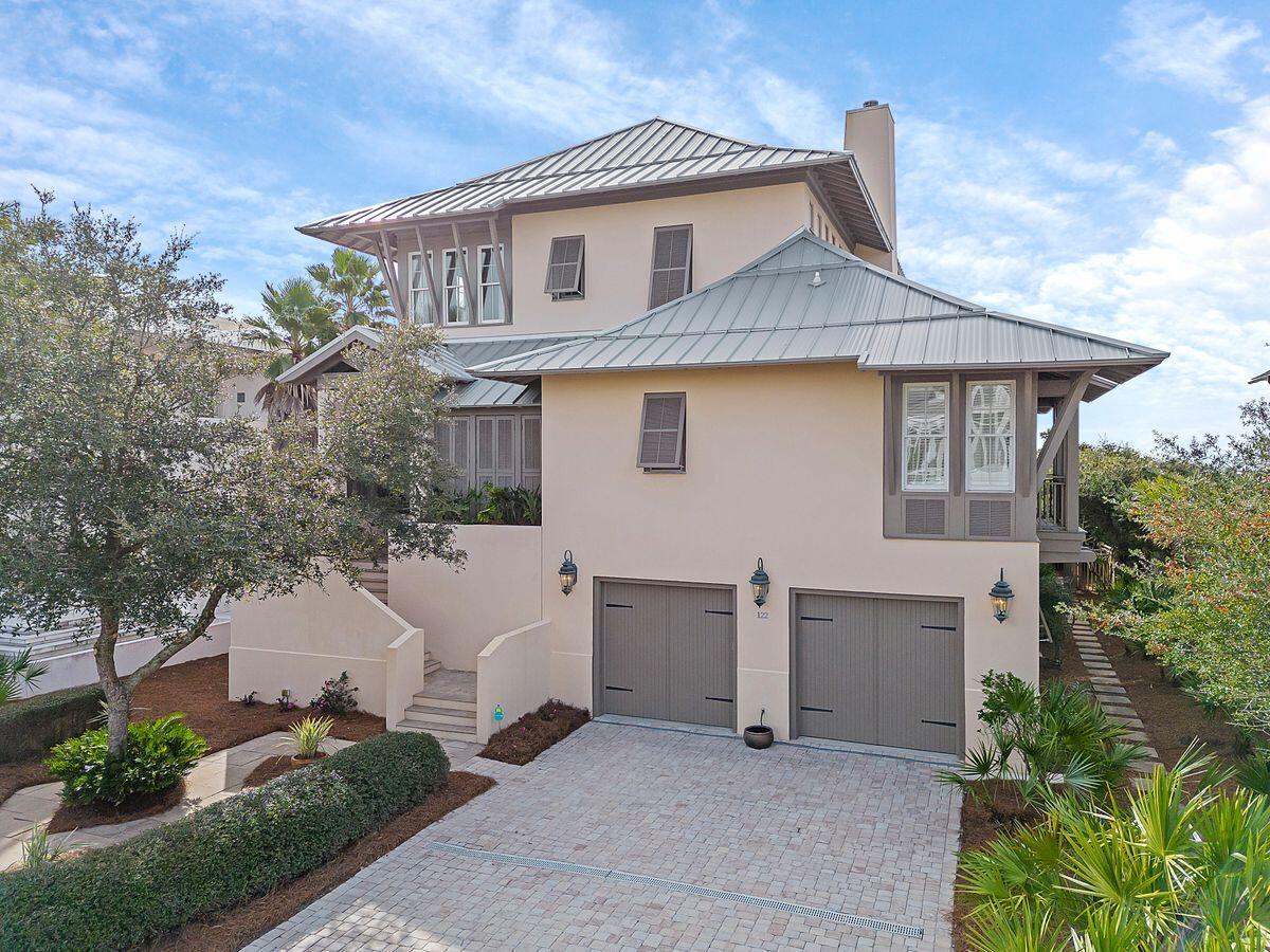 Situated behind the gates of the private, rental-restricted community of Camp Creek Point, and presiding over 75 feet of private beach frontage, this enchanting all-concrete residence provides an ideal locale to retreat from everyday life. A dual-bay garage provides security and easy access to the property from the ground level, while the front entry to the home is made accessible on the second level by the peacock paver-adorned walkway, complete with concrete-formed planters. The main level of the property boasts a spacious primary suite, complete with dual closets, a private office, a side balcony with gulf views, and a spacious en suite with walk-in shower and soaking tub. The primary bedroom provides gulf views as well as a private screened porch, leading to the sizable pool deck. On the primary level of the residence, a gulf-front living room with fireplace and large built-ins create a welcoming atmosphere while the chef's kitchen with breakfast nook and adjacent gulf-front dining area craft mesmerizing transitioning spaces. Through the French doors on the south of the home, access to the newly refurbished pool deck and outdoor dining areas crafts an experience rarely seen on this scale along the beach. An oversized pool deck surrounds the pool and spa, while covered outdoor dining and seating areas finish out the living spaces on the main level. Beyond the pool deck, a new, private boardwalk with a sitting area and Trex decking guides you to the sugar-sand private beach, gently screened by mature vegetation. The top level of the property provides three additional bedrooms, including a secondary primary suite with covered porch access, complete with plentiful seating and a relaxing swing bed. All three top-floor bedrooms provide en suite baths and generous storage. Along with its coveted footprint on the Emerald Coast, this opulent home boasts excellent proximity to WaterSound, Alys Beach, Rosemary Beach and all of the world-class shopping, dining and entertainment that South Walton is known for.