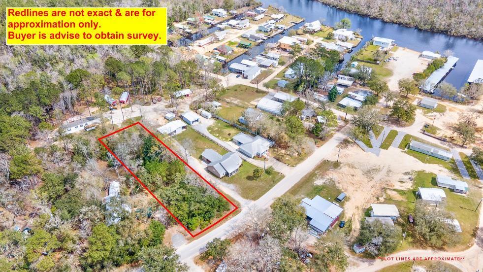 Beautifully wooded high-dry lot located within walking distance Black Creek, which leads to the spectacular Choctawhatchee Bay.  Enjoy sunrises/sunsets, fishing, boating & camping activities until your heart's content!!  

The property is located next to the Popular Black Creek Lodge & RV campground where folks have visited and enjoyed for years.  Black Creek Lodge has a large boat ramp that you can see from the lot.  Locals can utilize the ramp for a nominal fee.  

If you are looking for comfortable & relaxing property to establish your dream home or just a fabulous spot to retreat, this is it!!  

Property is unrestricted; Allows mobile homes; No HOA; Zoned Rural Village and is Flood Zone X.  This lot checks all the boxes!!  Nice lots like this one giving you lots of flexibility do not come along often! 

If you are looking for comfortable and relaxing property to establish your dream home or just a fabulous spot to retreat, this is it!!  It's conveniently located within 20 mins to world famous sandy white beaches of Florida's Emerald Gulf Coast. Lots of area nature to take in with numerous state parks, springs and rivers nearby. 

Property requires septic tank at this time. Public water is available. Tap Fee due.  There is talk of future sewer coming to this area. Check with City of Freeport to confirm timelines.

Buyer needs to perform due diligence regarding building codes and/or zoning regulations with proper local authorities to ensure buyer will be able to utilize the property for intended use.  Information contained within this listing is deemed to be accurate, but is not guaranteed.