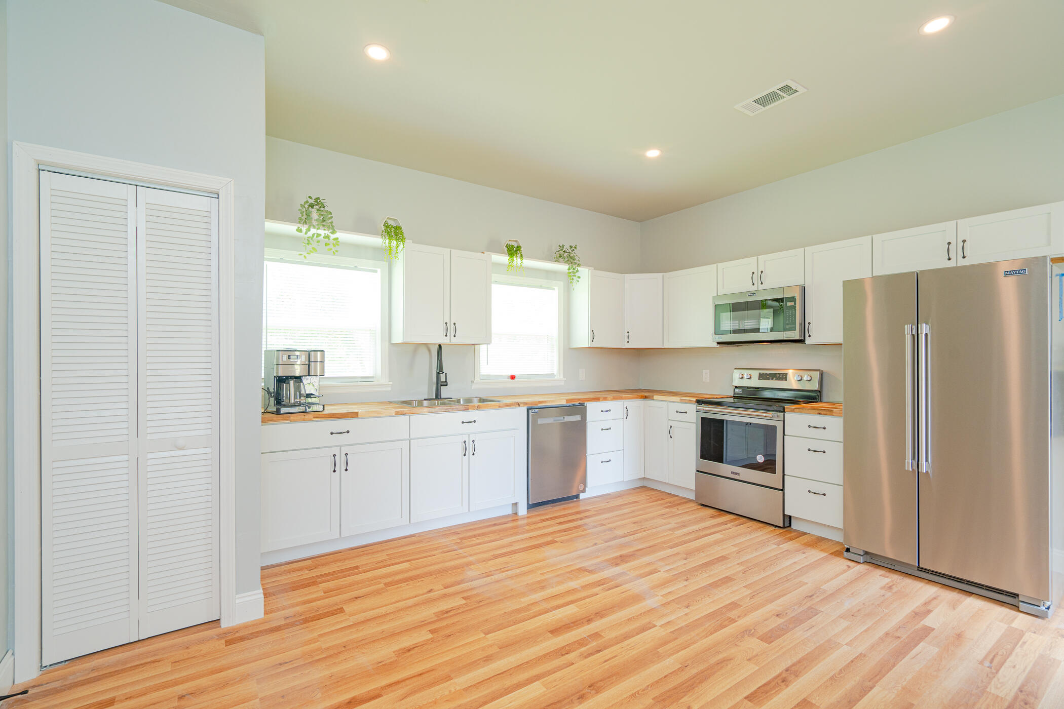 OPEN HOUSE 11-12 on Saturday 10/29/22. Want a new home at an older home price?  Want the security and comfort of updated electrical and plumbing?  Want the ability to take this beautiful home and adding your own charm without HOA fees and restrictions?  This is the home for you.  Completely renovated home (with permits!) with brand new kitchen, bathrooms, bedrooms, and living space.  Built in storage in the living room, plenty of lighting from the windows and new lighting fixtures.  New deck, custom closets, custom bathrooms, and spacious kitchen allows you to fill this home with your touch and love.   The house is open, cozy, and bright.  The lot is also zoned as commercial and residential so you could truly turn this property into your dreams!