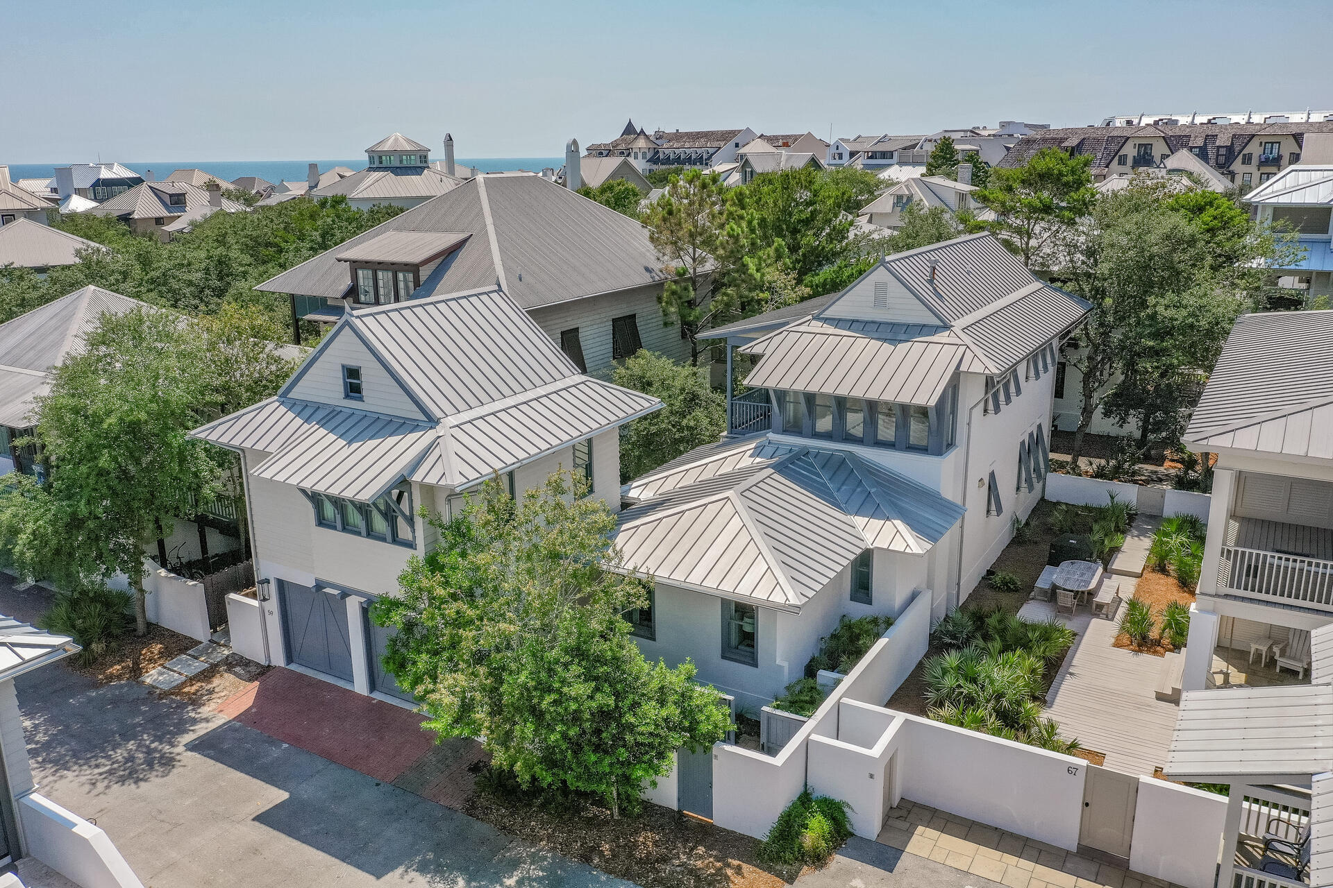 Originally built in 1999 and extensively remodeled in 2016, including a first floor primary bedroom and bath addition, this stunning home offers a relaxing coastal retreat in the heart of Rosemary Beach.  The carriage house, with full kitchen and separate bedroom was also built in 2016, along with the private pool.  Perfect for full time living, a second home (it has been both since newly built) or a vacation rental with rental projections of over $261K.  The large, chef's kitchen provides plenty of space for multiple cooks and helpers - subzero refrigerator is just a few years old.  Thoughtfully designed, the primary, first floor bedroom has a large walk-in closet with built ins and an ensuite bath with double vanity and a separate shower and soaking tub.  Custom built bunks are outfitted in one of the upstairs bedrooms, also with a private, ensuite bath.  The second upstairs bedroom could also be used as a second, primary bedroom.  Both upstairs rooms open onto an expansive balcony overlooking the luxurious courtyard below.  The carriage house is self sufficient with a full kitchen and a separate bedroom with barn doors to close it off from the living space.  Sold furnished with minor exclusions. Information in listing is deemed accurate but buyer to verify.
