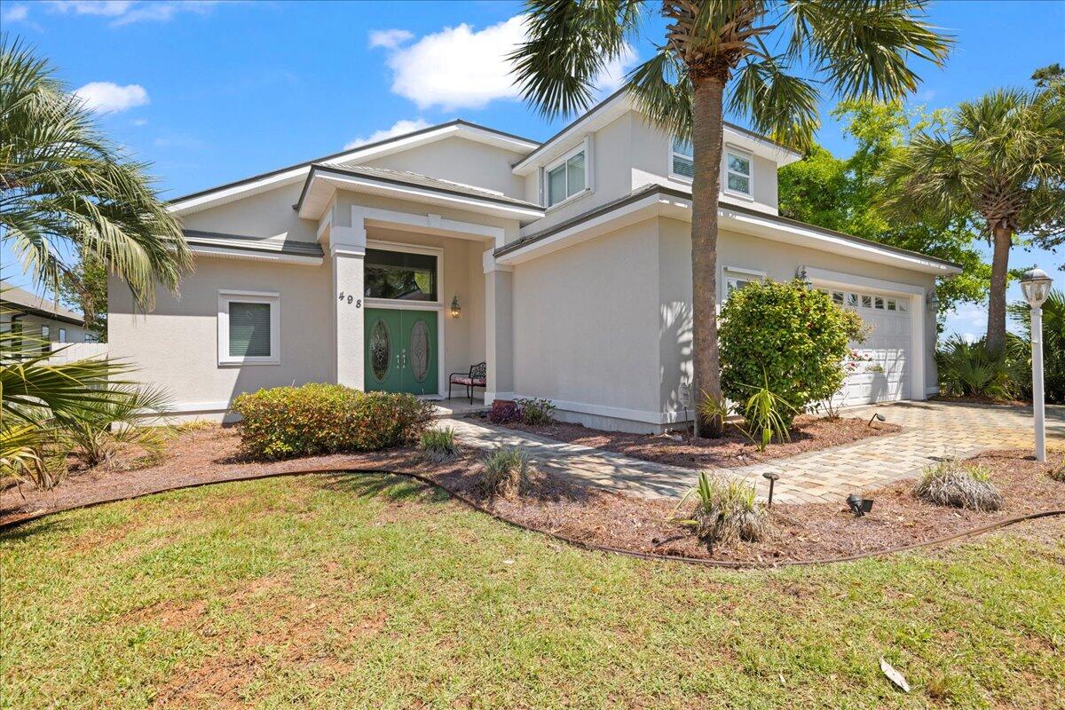 Bayfront Beauty with Custom Features & Breathtaking Views!

Don't miss this rare opportunity to own an award-winning, custom-built bayfront home with 85 feet of stunning waterfront. This 3-bedroom, 2.5-bath gem is designed for both comfort and style, featuring a spacious open floor plan, cathedral ceilings, and panoramic bay views that set the scene for peaceful living and elegant entertaining.

The gourmet kitchen boasts granite countertops, custom cabinetry, and plenty of space for gathering. Retreat to the master suite and enjoy your private slice of paradise with a tray ceiling, large walk-in closet, and a gorgeous view of the bay to wake up to every morning. This home is packed with premium upgrades, including:

WaterFurnace geothermal HVAC system
Storm shutters & 8-ft wind-rated garage door (perfect for oversized vehicles)
Whole-house generator
Built-in pest deterrent system
Irrigation and security systems
And for boating enthusiasts  there is a boat dock that comes equipped with a boat lift, making it easy to get out on the water at a moment's notice.

This home is the ideal blend of luxury, durability, and waterfront living. Schedule your private tour today and experience bayfront living at its finest!