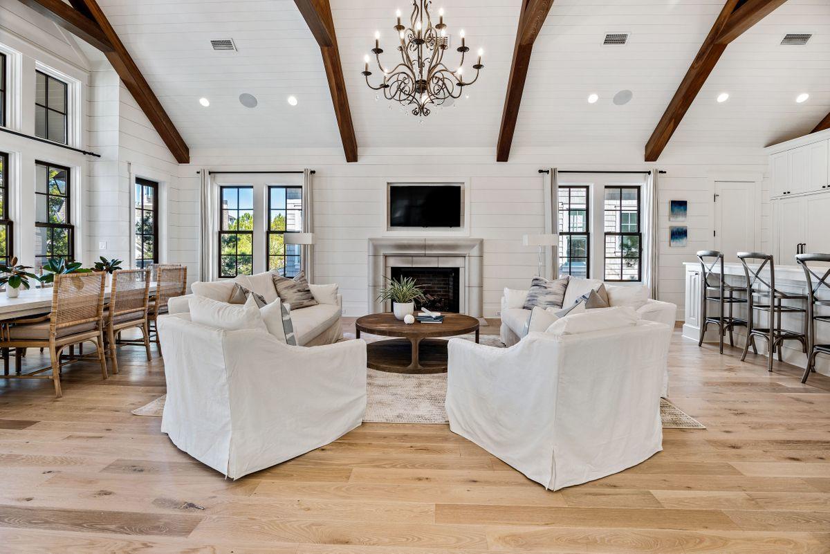 This beautifully detailed Nantucket-style masterpiece is located in the highly desired gated neighborhood of WaterSound Beach along Scenic Highway 30A. This magnificent home offers impeccable design and quality throughout. Step inside to a bright open floor plan, professionally decorated by Dwell Interiors, featuring oak flooring, a gracious living area with vaulted ceiling, gas fireplace, and state of the art gourmet kitchen with marble countertops, and professional stainless steel appliances. Relax in the stunning master retreat with ensuite bath that includes marble countertops and flooring as well as a large walk-in shower and separate soaking tub. Outside, enjoy the private heated pool with a water feature as well as a covered porch, the perfect spot to relax. Other amenities include a private elevator, carriage house with two-car garage, security system, and perhaps best of all, this home is a short distance to the white sandy beaches, the Beach Club, parks, and other recreational facilities. WaterSound Beach features walking paths, dune walkovers, and offers a resort-style swimming pool located within the community. This is the home you have been waiting for that promises years of enjoyment for generations to come.