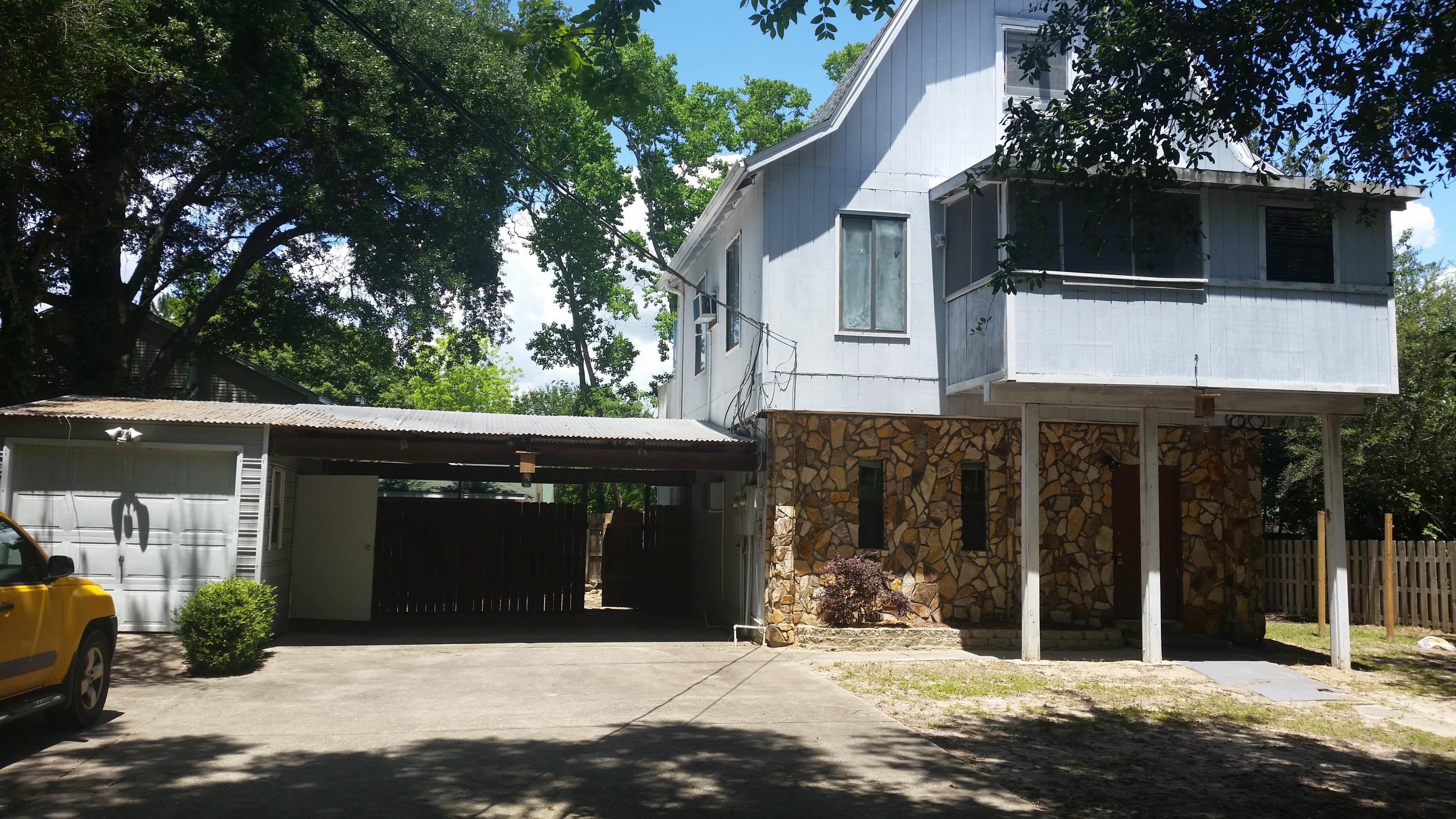 Great two story apartment on a large private lot. Located on the second and third floor of a three story duplex. Large living area with a fireplace and small separate office, could be used for a kids bedroom. Nice screened and covered Florida room. Upstairs you'll find the good sized master bedroom with tons of storage and a private bath. Washer and dryer hook ups in a separate storage building. Call today!