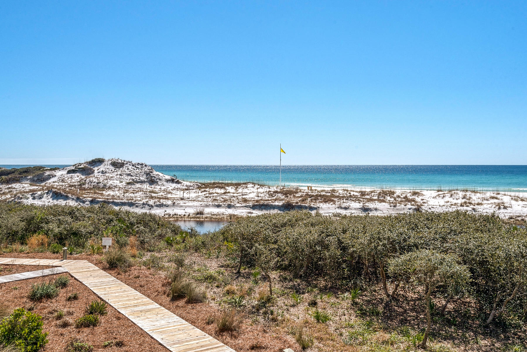 Complete renovation on this beautiful Gulf Front condo in WaterSound Beach. Fresh updates & elegant decor make this property totally stunning! From the minute you enter this property, the Gulf views will totally amaze you. This single-level, second-floor location is the best of both worlds.... You get phenomenal views, but with minimal stairs! (there is also elevator access) The residence itself has beautiful hardwood and tile floors throughout, and an open gourmet kitchen with stainless appliances and a new gas range. The corner location of this residences takes full advantage of the views and offers amazing outdoor/porch space(s).