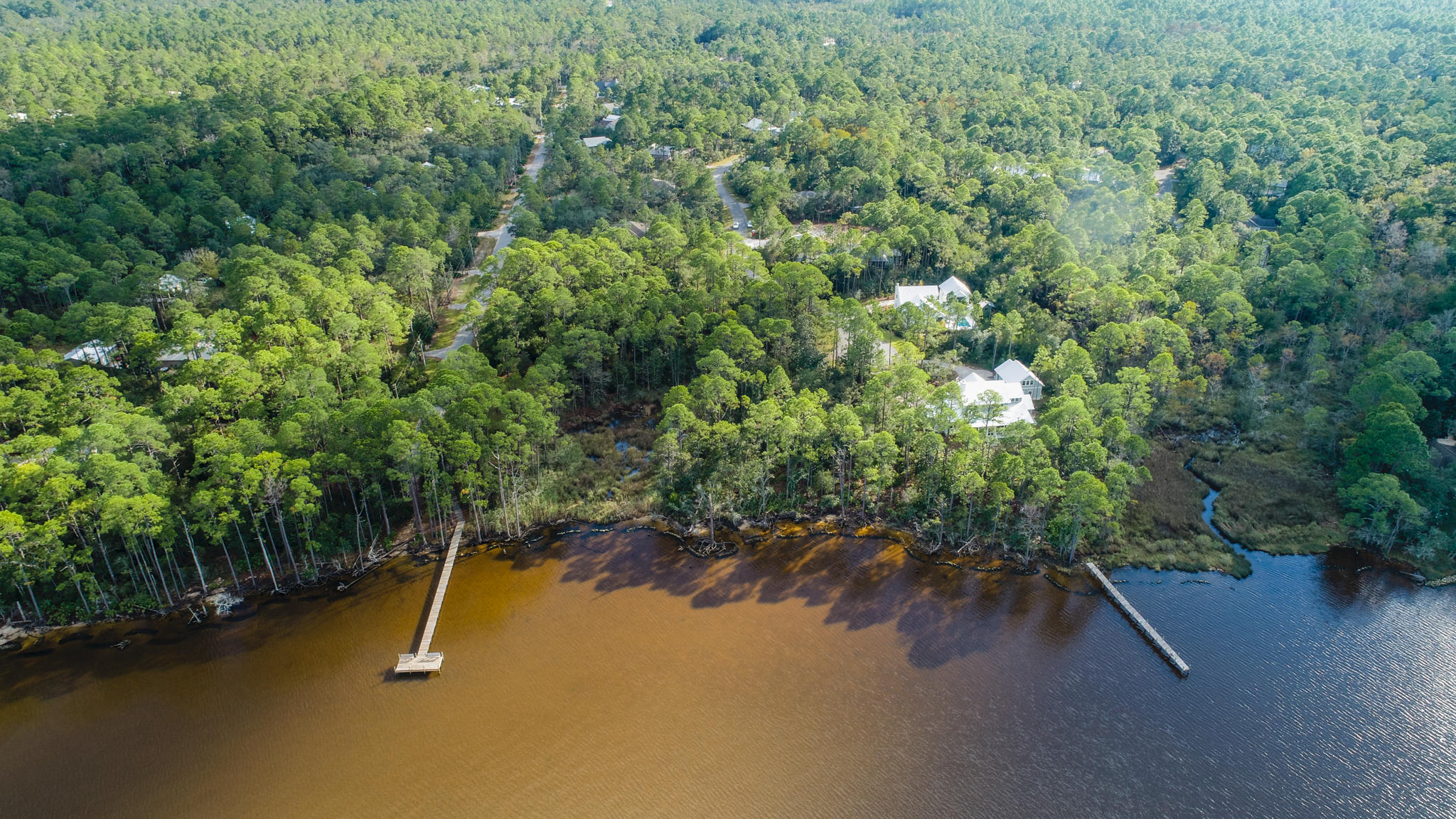 Unprecedented waterfront homesite in Point Washington on Choctawhatchee Bay! Boasting over 1.5 acres and 291 feet of waterfrontage, this estate property offers future homeowners the unique opportunity to build of one-of-a-kind private bayside compound retreat. The size of the property allows for the construction of an oversized dock and multiple boat lifts. Situated in The Woods subdivision, architectural guidelines protect the value and characteristics of the community. The homesite is bordered by over 2 acres of neighborhood community park, offering seclusion rarely found. Located just minutes to 30A, future homeowners will have quick access to the sought after entertainment, shopping and dining found in the nearby 30A communities.