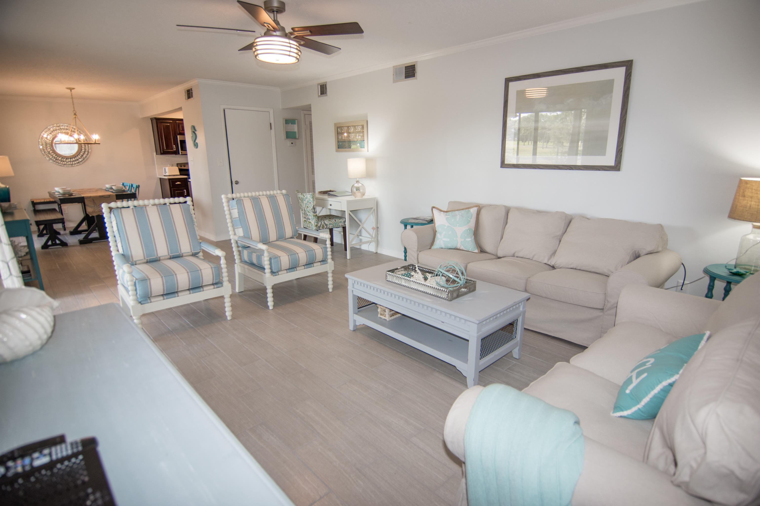 The perfect beach retreat with lake and Gulf views nestled in the Seascape Resort. This beautiful 3 bedroom condo has been recently renovated and includes many upgrades including wood look tile throughout the main living areas, a gourmet kitchen with new stainless steel appliances and quartz counters, a remodeled guest bathroom, new toilets and sinks, all new lighting, washer and dryer, and beautiful coastal furniture and décor throughout!  This building has a new roof (2019) and an exterior storage closet for you or your guests. You can easily sleep 10 with a bunk room and sleeper sofa. You and your guests will love the large patio overlooking the lake and golf course and the porch swing. Just a quick jaunt to the beach plus access to all the Seascape Beach Resort has to offer including sparkling pools, golf, lighted tennis courts, bike rentals, basketball half courts, lake, gated access from both Scenic 98 and Hwy 98 and lush landscaped grounds. Located near the front entry is the new Towne Center with dining, entertainment and shopping options without leaving the resort. This condo is being offered fully furnished and equipped with excellent rental history...too many 5 star reviews to count from previous guests!