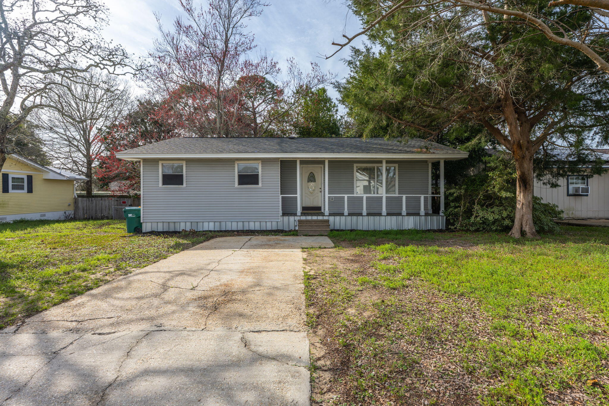 This 2 bedroom and 2 bath modular home offers a clean, modern feel with several updated features. Situated in Mary Esther Florida and only 2.7 miles to Hurlburt Field, 14.4 miles to Eglin Air Force Base and a 12-minute drive to our beautiful white sandy beaches of Navarre! The decorative oval glass front door welcomes you inside, where you'll find new LVP flooring, fresh paint, and updated baseboards throughout. The kitchen is equipped with mostly stainless-steel appliances, including a smooth stove top and a double stainless-steel sink, complemented by laminate countertops and a tile backsplash. The home includes a cozy dining area, an inside laundry room, and a master bath with a shower only. Outside, the fenced backyard provides privacy, and there's a yard shed for extra storage along with a detached covered patio for relaxation or entertainment. New blinds complete the fresh, updated look.  Don't miss out on this great opportunity to make this your next real estate investment.