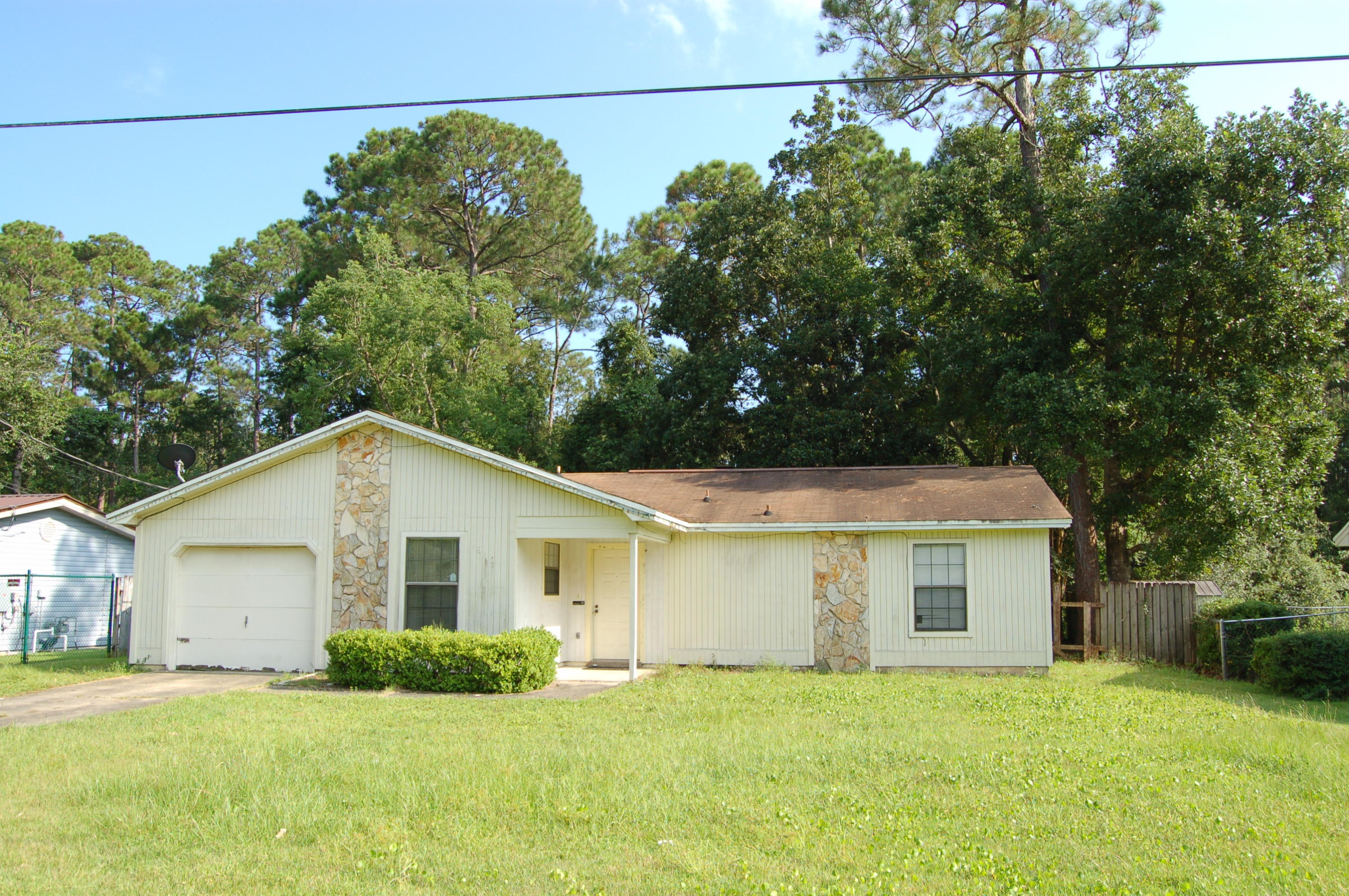 Cozy property located close to Hurlburt Field and Eglin Air Force Base.  On a short distance to local shopping and many conveniences of the Fort Walton Beach area.  The property has three bedrooms and two baths with plenty of room to stretch out.  Kitchen provides easy accessibility with plenty of cabinet space and nice flow into living room area.  Living room has a built-in fireplace and a beautiful view of the backyard. Main bedroom has a walk-in closet and attached bathroom providing great convenience. One car garage is perfect work area and alternate storage area.  Backyard is spacious and great place to enjoy yourself after a long day at work.  Please call today to schedule an appointment and make this your next home! Roof is 2005.