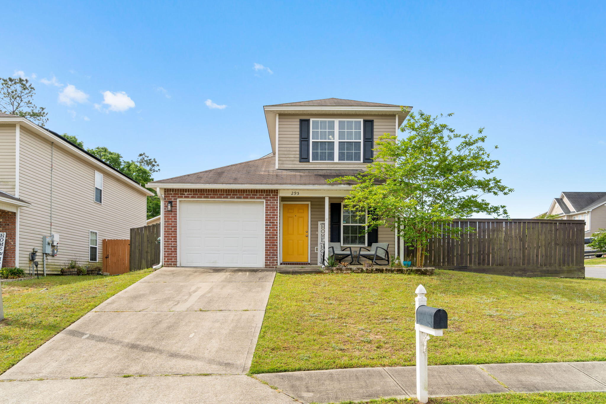 Welcome home to this lovely 4 bedroom, 2.5 bath home in the popular neighborhood of Stillwell Estates on a corner lot complete with a roomy upstairs loft in a perfect south Crestview location! Downstairs you'll find a split floor plan with a spacious living room open to the kitchen complete with stainless appliances, lots of natural light, and hard surface wooden flooring that extends throughout the guest bedroom downstairs as well as the master bedroom. The owner's bathroom has double vanities and a large walk in closet. Also located on the first floor is the half bathroom and the interior laundry room. Upstairs you'll find a great sized bonus loft with a closet (perfect for a game room, office, playroom, etc), a spacious guest bathroom, and two great sized bedrooms with ample closet space! Outside is a fully fenced in yard complete with a double gate on the corner lot, bring your boat or easily access your backyard from the road!