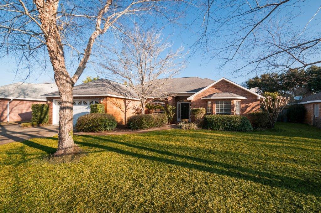 This beautiful brick three bedroom, two and half bathroom home is located in the heart of Destin near the Choctawhatchee Bay off of Indian Trail . This home offers a split floor plan with a spacious entry way that leads to the dining room and an open living room, which features a cathedral ceiling and a gas fireplace. The kitchen comes equipped with plenty of cabinet space, a breakfast bar, and a breakfast nook. In the master suite you will find tray ceilings as well as a double vanity, jetted tub, and a separate shower in the bathroom. The second bath is very practical with a Hollywood bath featuring separate sinks and vanities. There is also a hallway half bath. This is a great family neighborhood with a community pool