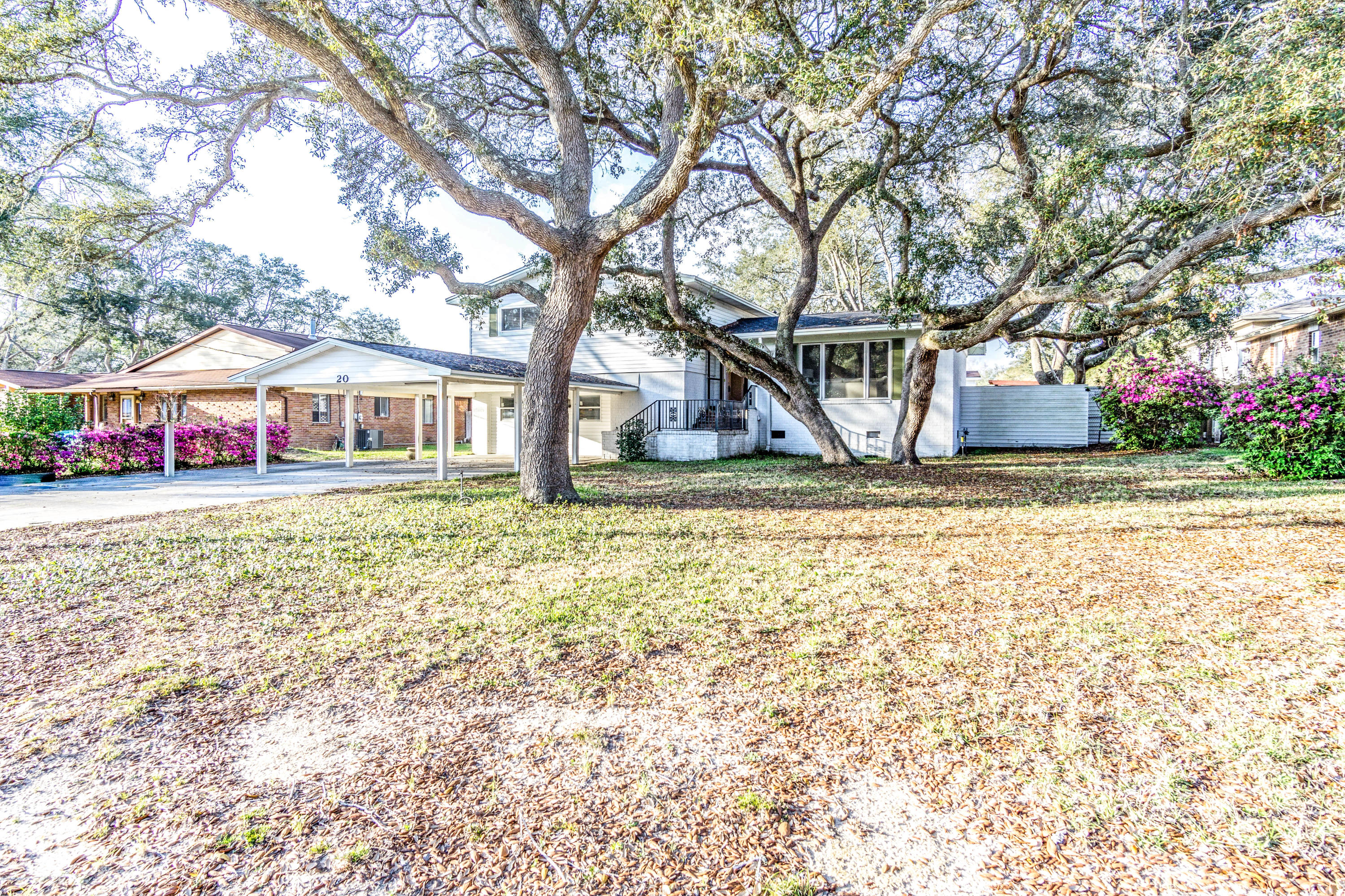 Rare opportunity to own a home on a large lot with mature oak trees on Dogwood Drive in Shalimar. 2255 sq/ft, 4 Bedroom and 3.5 bath with cozy atmosphere. Beautiful original solid wood floors in bedrooms. Kitchen overlooks the large back yard and is appointed with tile, smooth top stove, and large French-door refrigerator. Separate dining room and living room. Downstairs has separate kitchenette or wet bar as needed, family room/game room and the 4th bedroom could remain or be substituted as a bonus room/office. Just outside the back door is a large screened porch. Newer roof (2014) This property allows access from 1st avenue at the rear of the property, which is a huge plus! Plenty of parking on the extra wide driveway. The back yard has the large vinyl fence (low maintenance), an elevated deck, a large storage shed, a small yard shed (as-is condition), and a life-size kids play house. Come see why Shalimar is so desirable!!